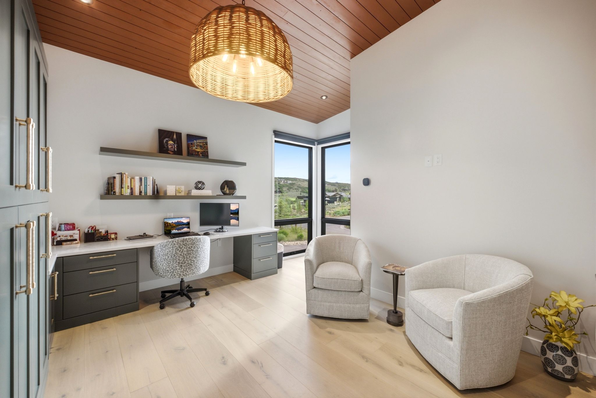 Vaulted wood-paneled ceiling with a woven pendant light fixture