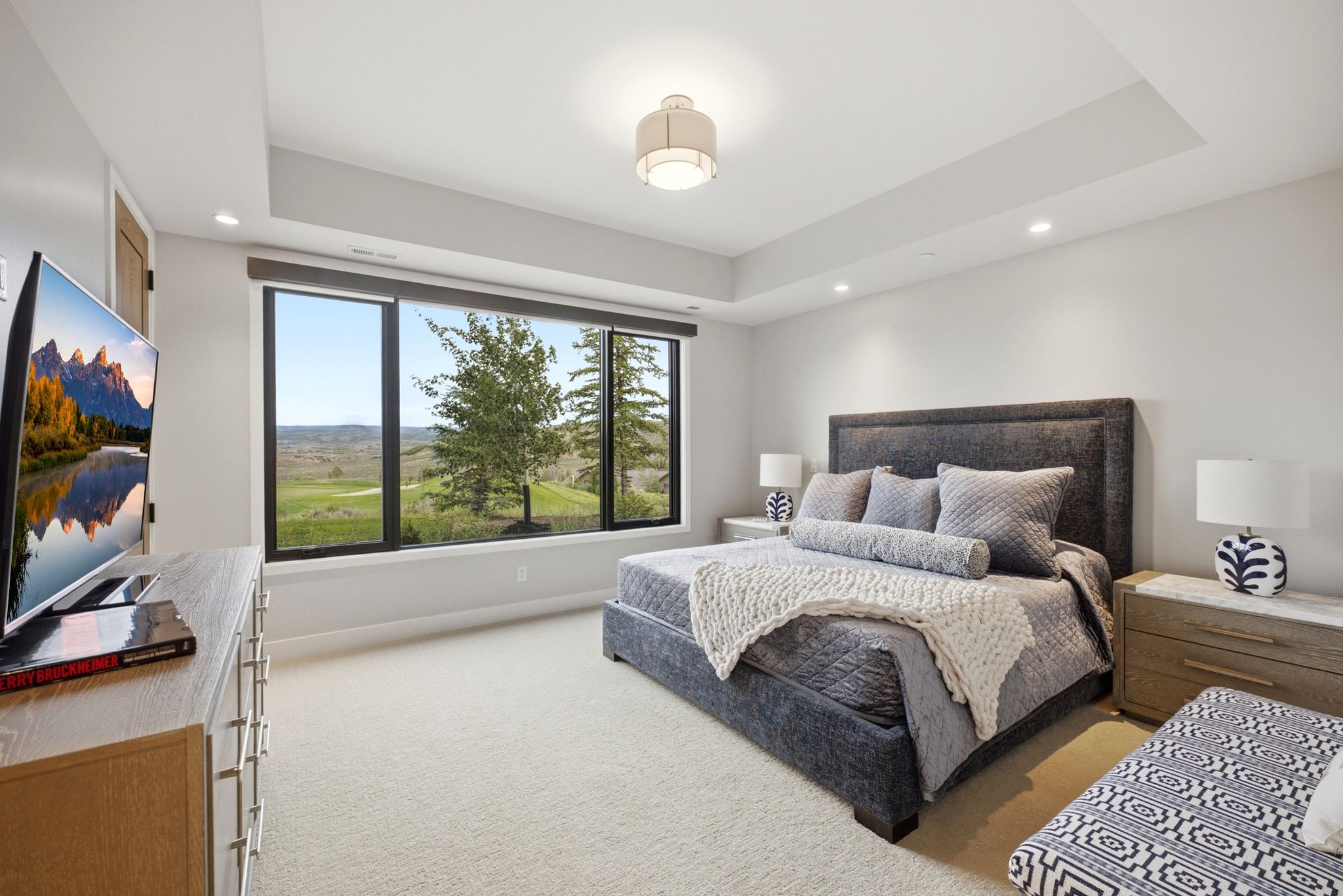 Expansive window wall overlooking natural landscapes