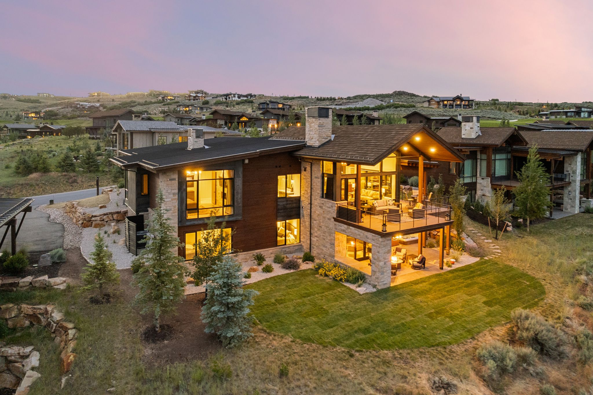 Contemporary residence featuring extensive stone and wood siding