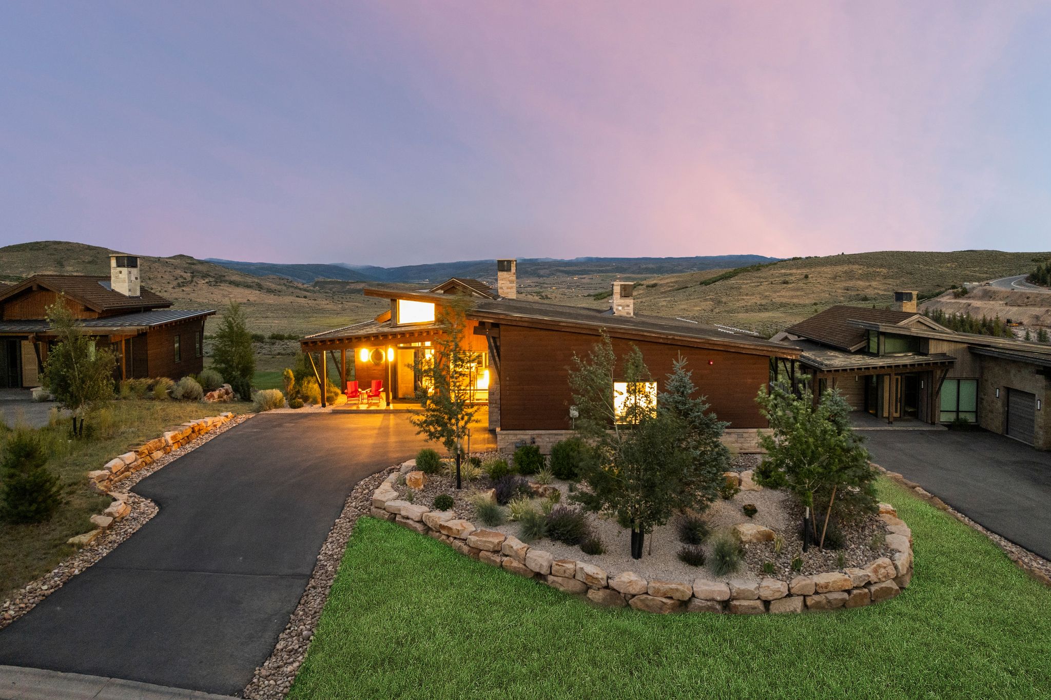 Contemporary architectural residence featuring a prominent covered entry porch