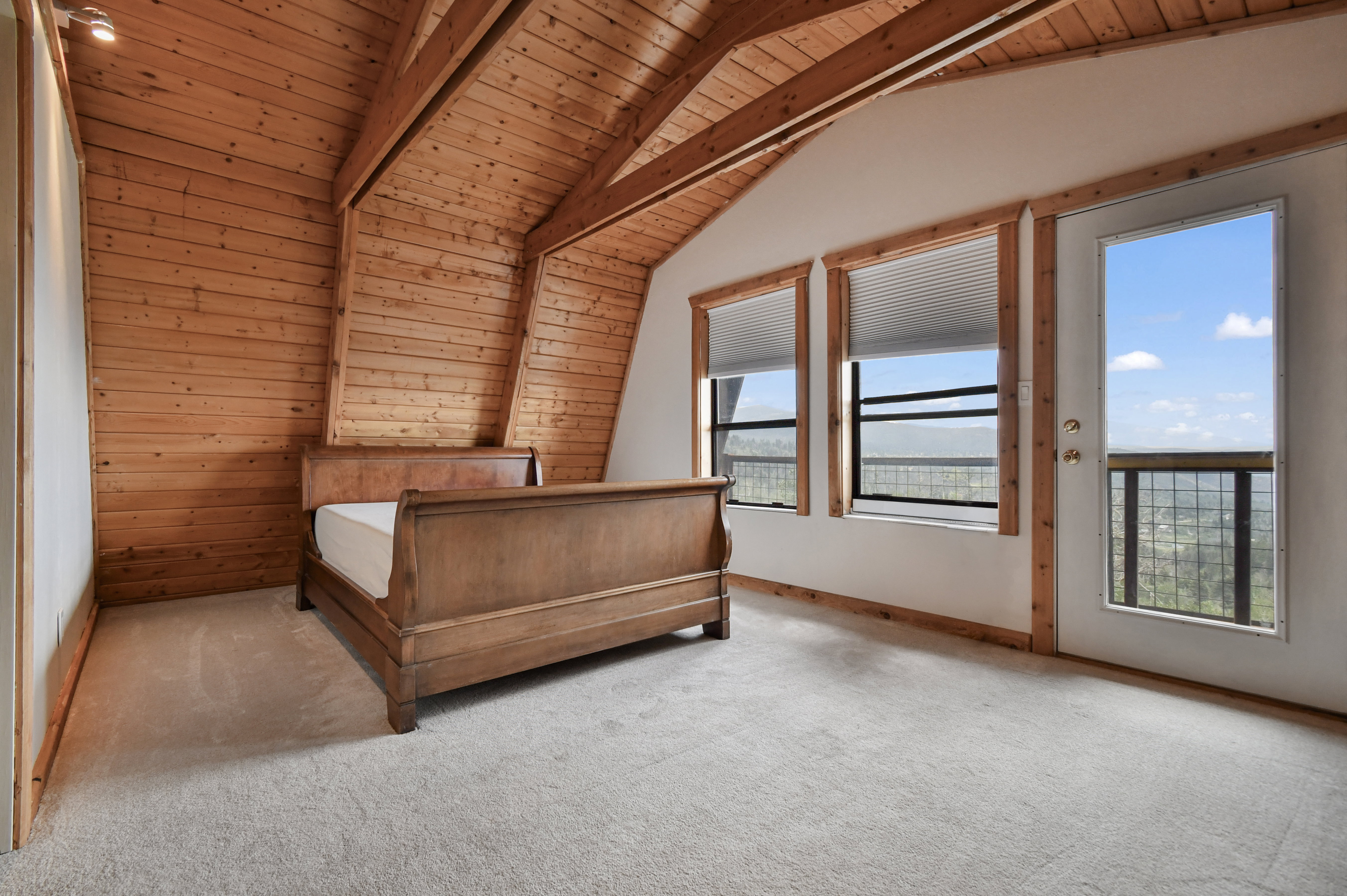 Vaulted wood-paneled ceiling with exposed beams