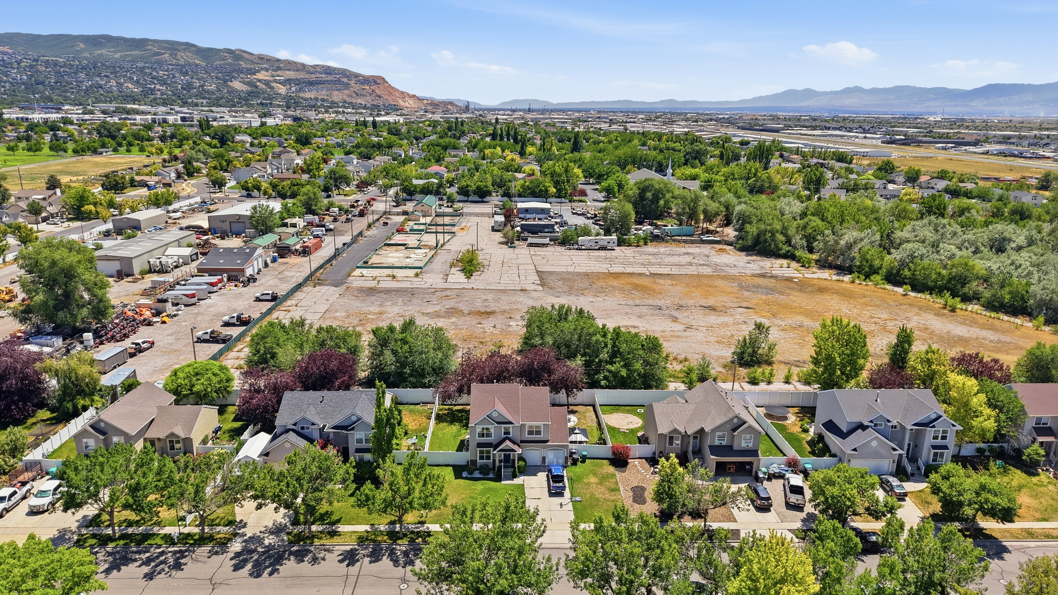 Residential neighborhood featuring a tree-lined street and varied architectural styles