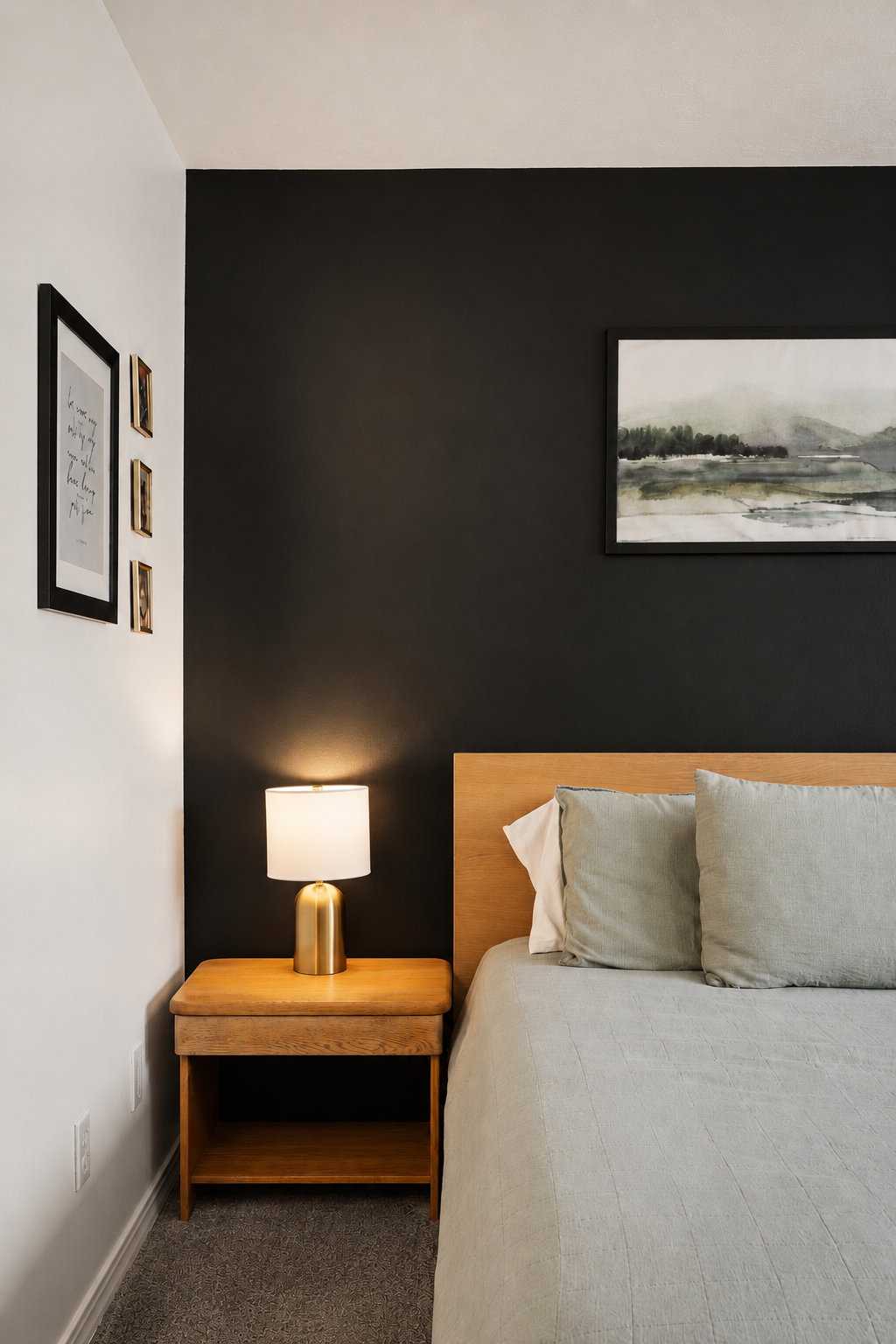 Accent wall with contrasting paint, wood-finish flooring, and a light wood headboard