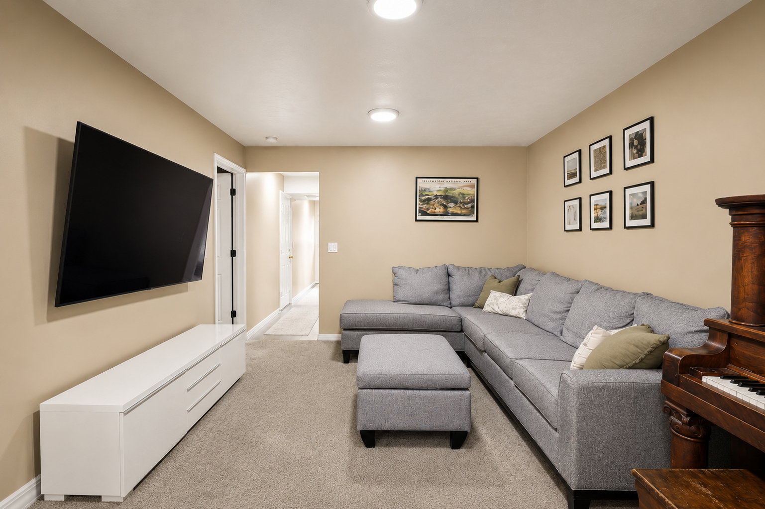Carpeted room with recessed lighting and neutral wall tones