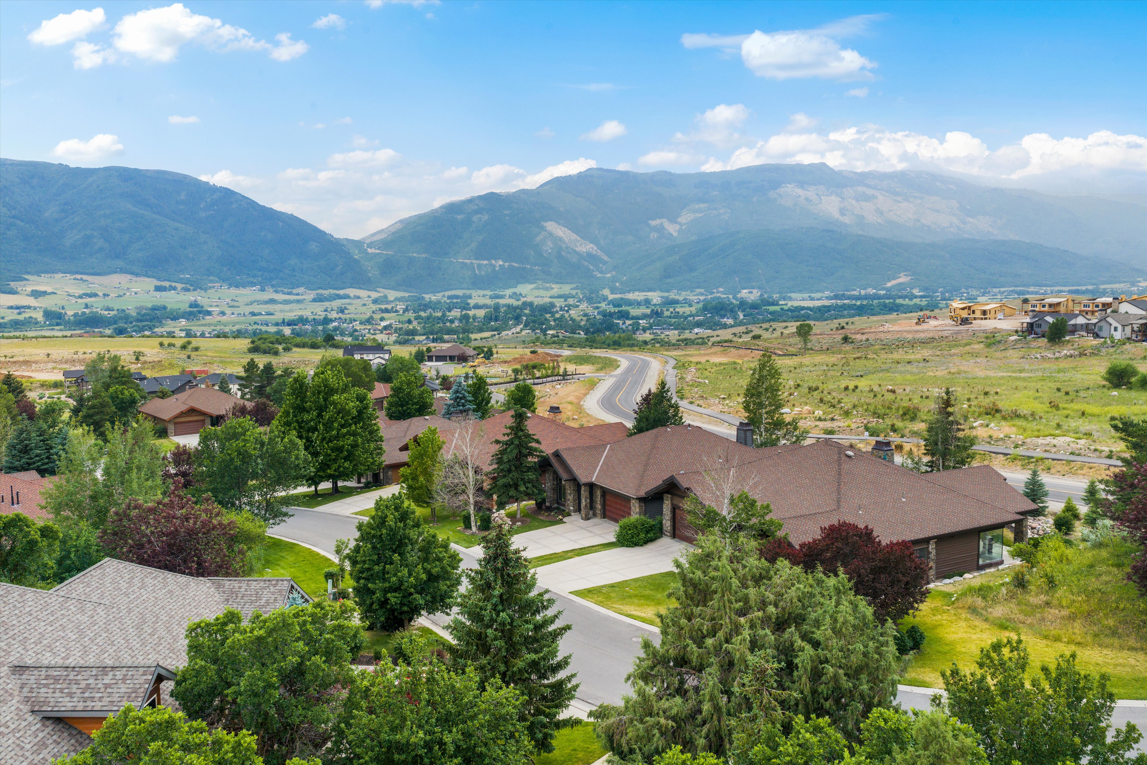 Expansive mountain backdrop featuring multiple peaks and a wide valley floor