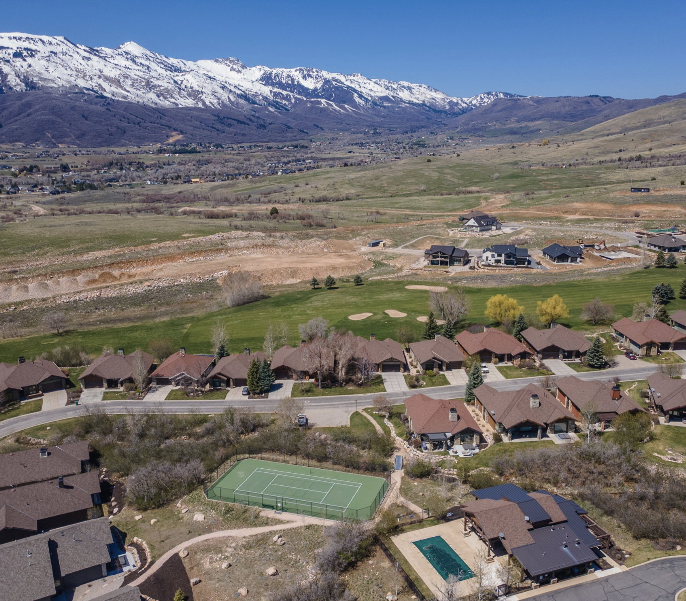 Expansive mountain backdrop with snow-capped peaks