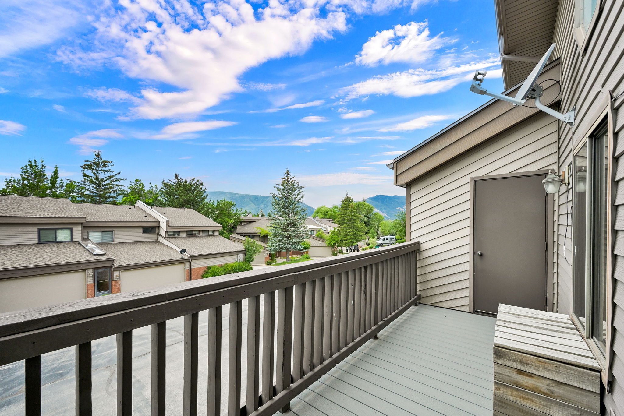 Private balcony featuring a wood railing and composite decking