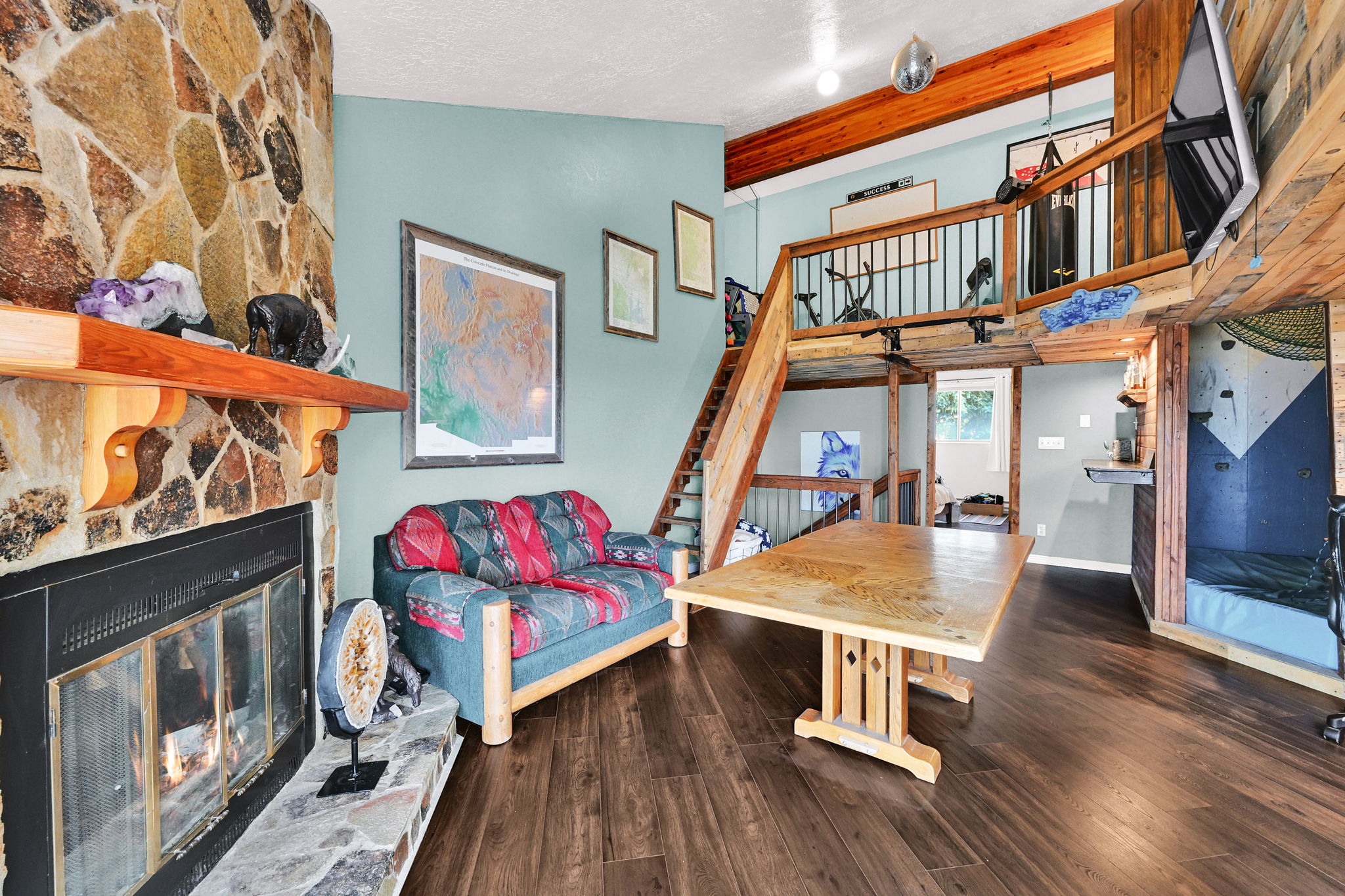 Living area with high ceilings and wood-finish flooring