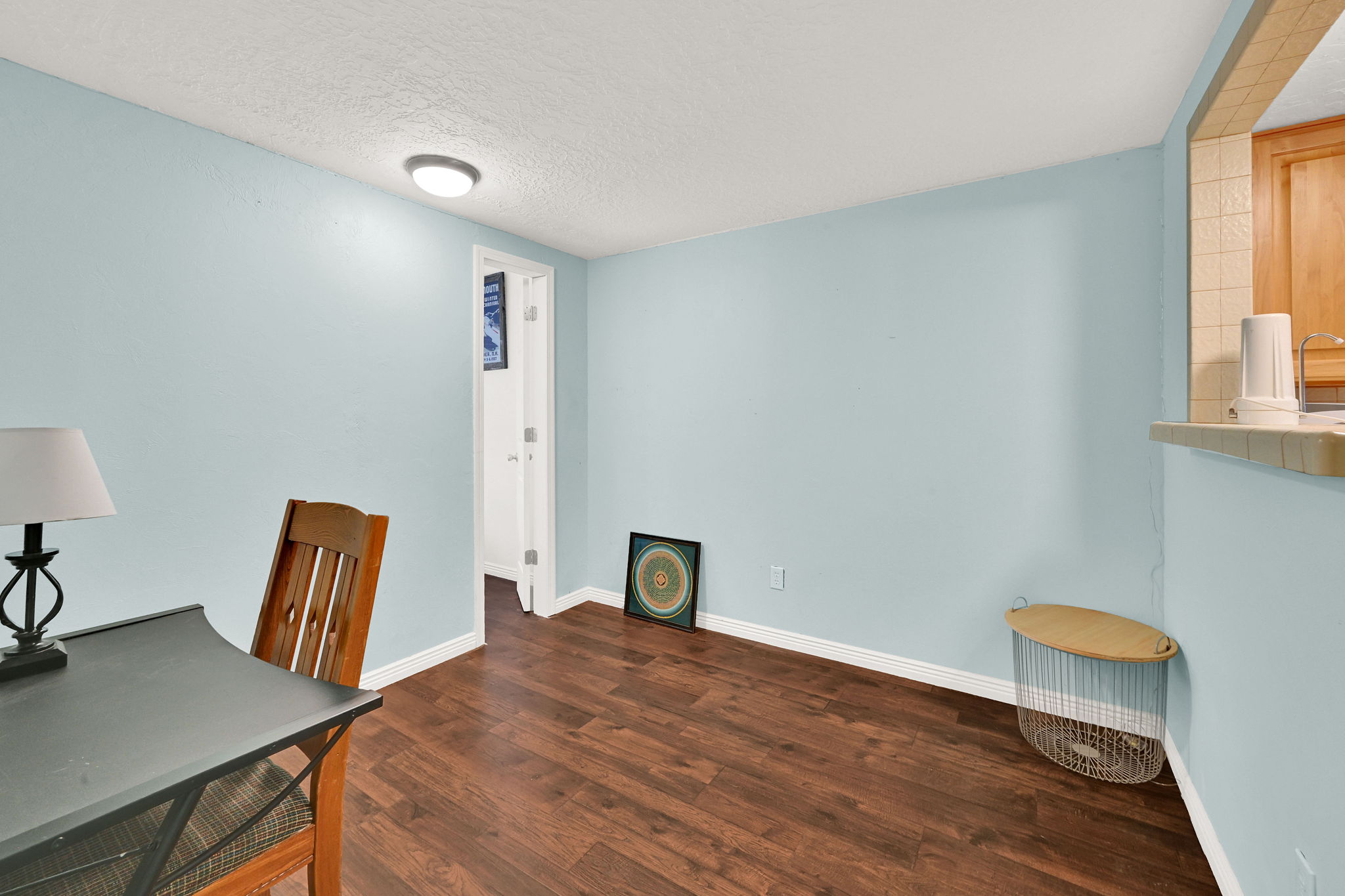 Interior space featuring wood-finish flooring and light blue walls