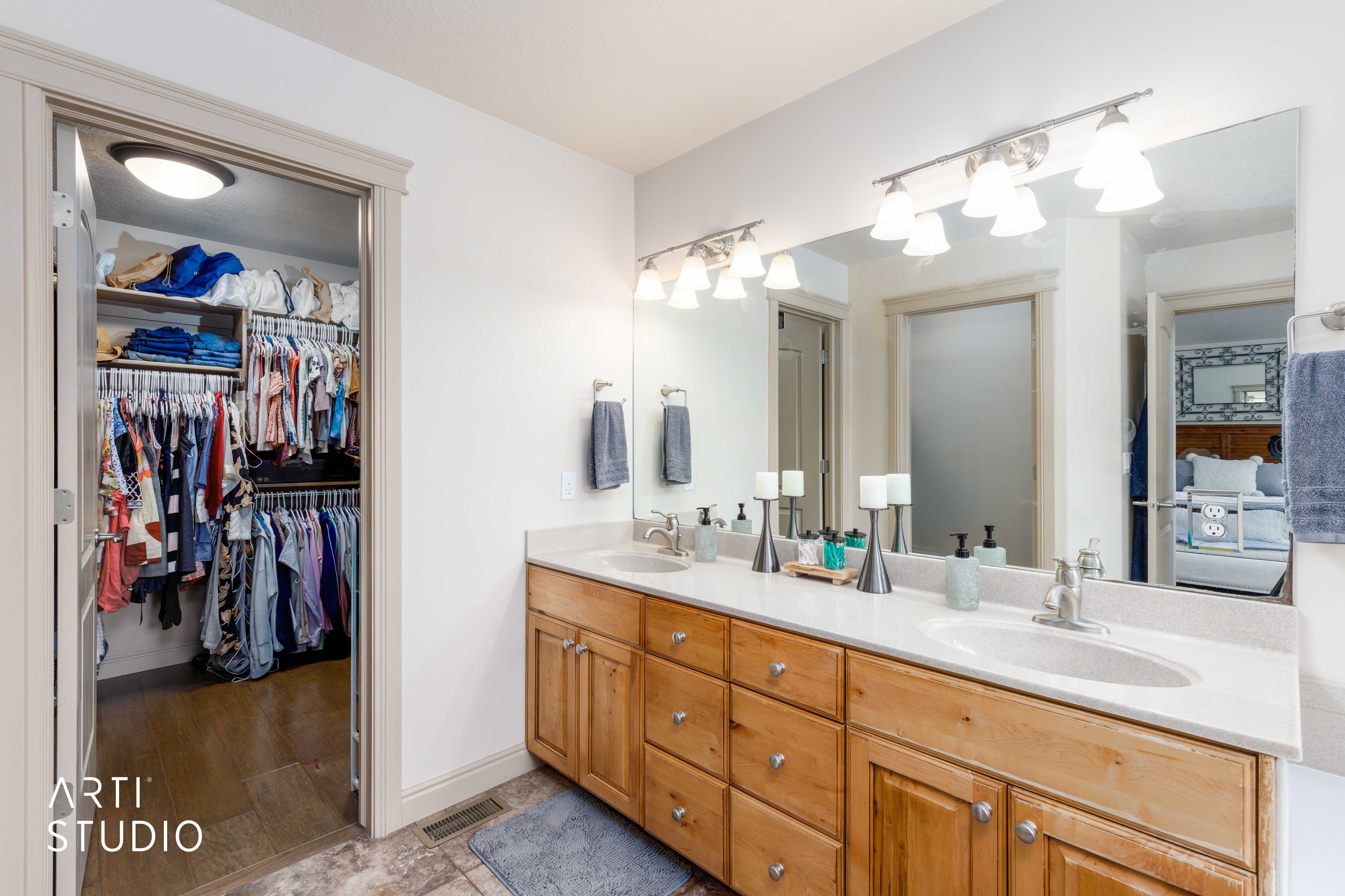 Dual vanity and walk-in closet.