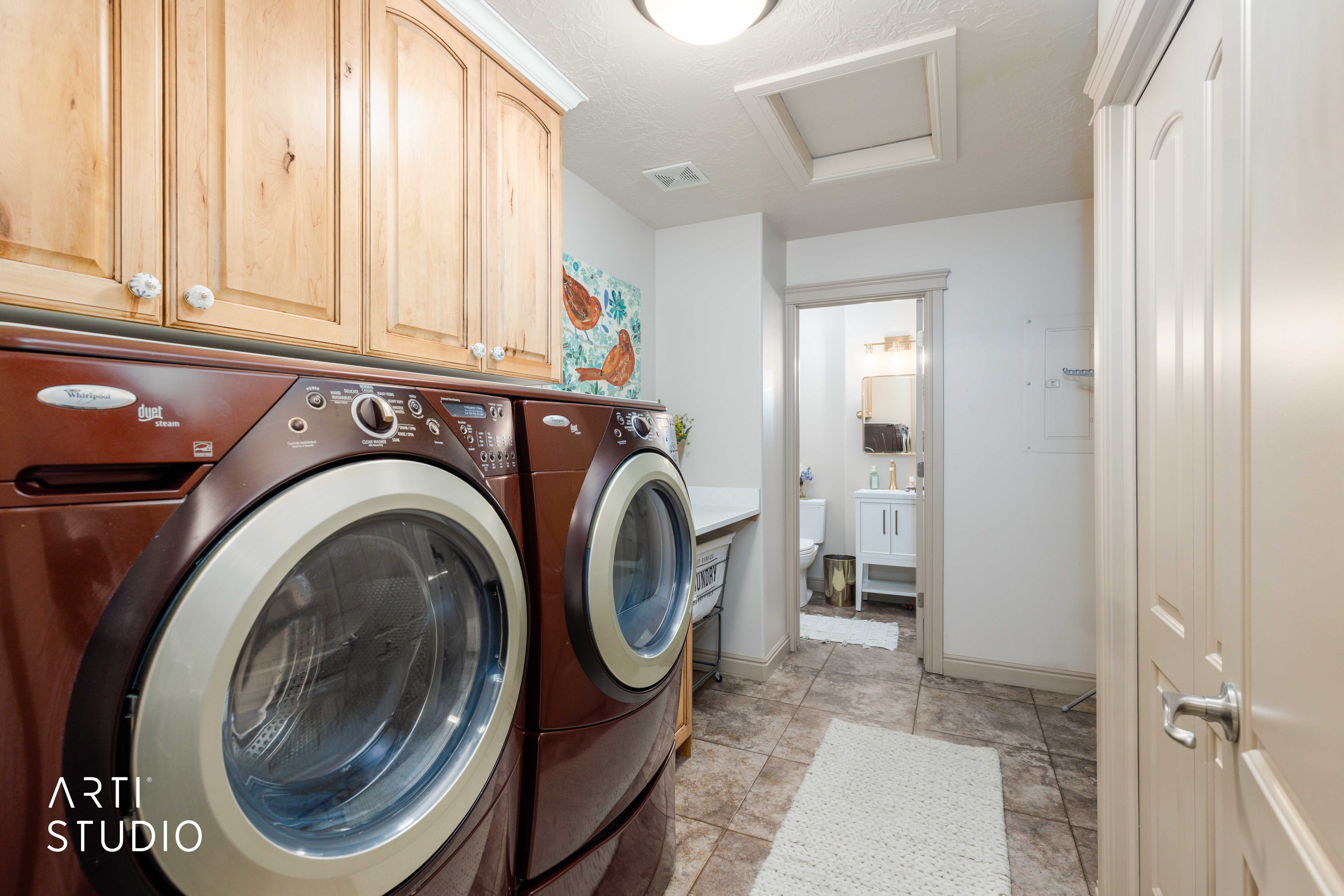 Main level laundry room with two piece bathroom