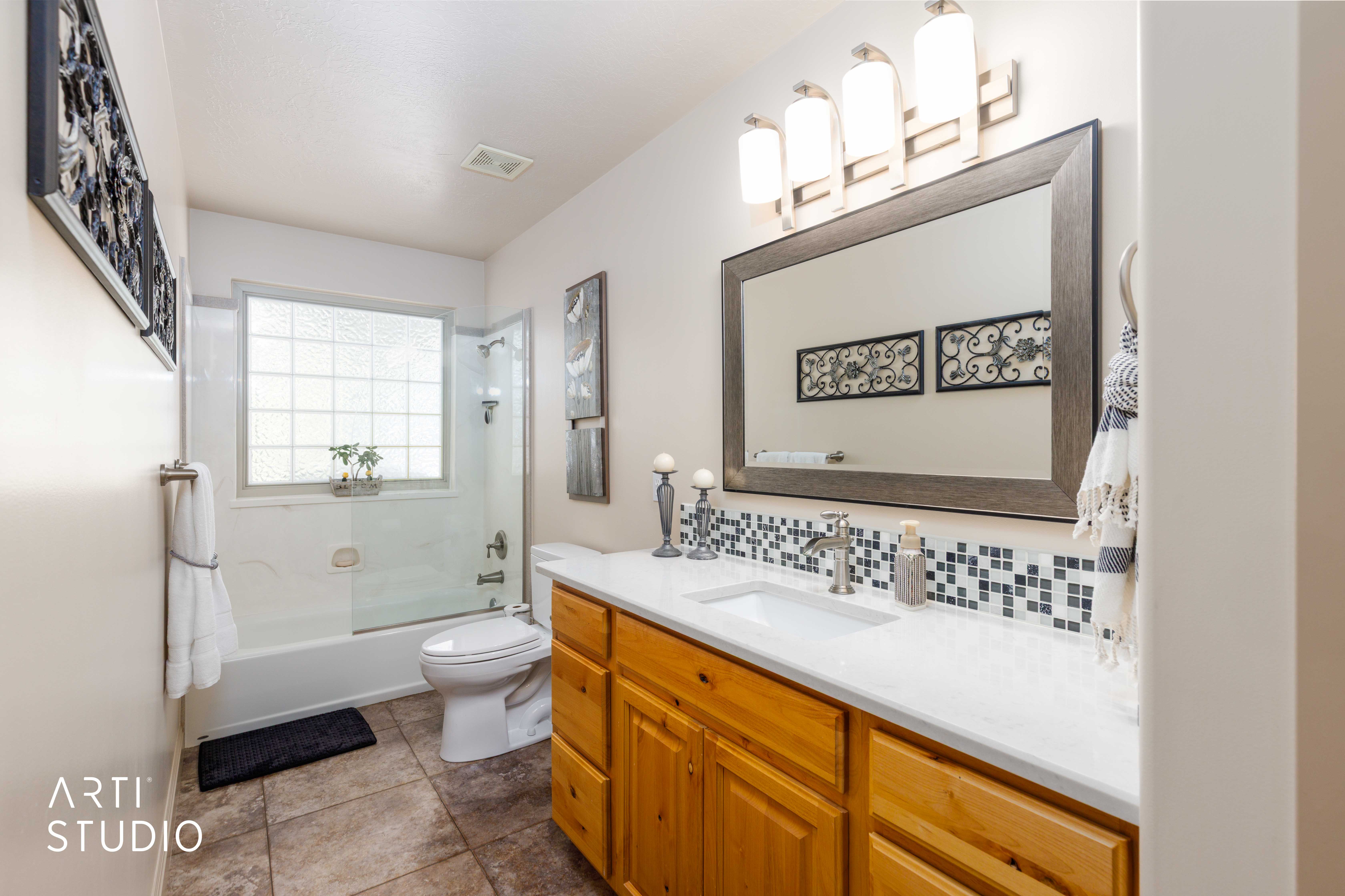 Main level bathroom with tile flooring