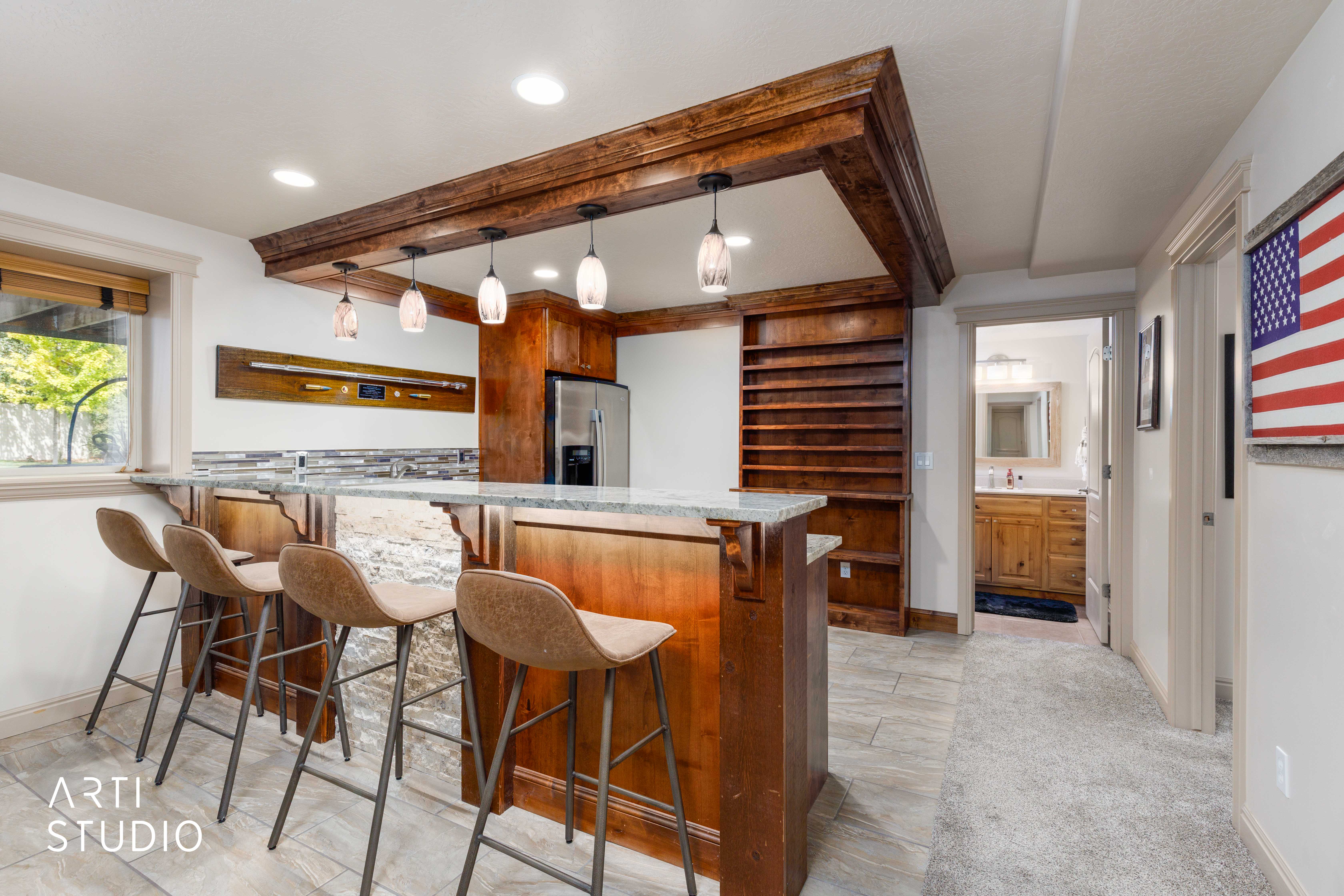 Bar area with full size refrigerator, sink, and microwave