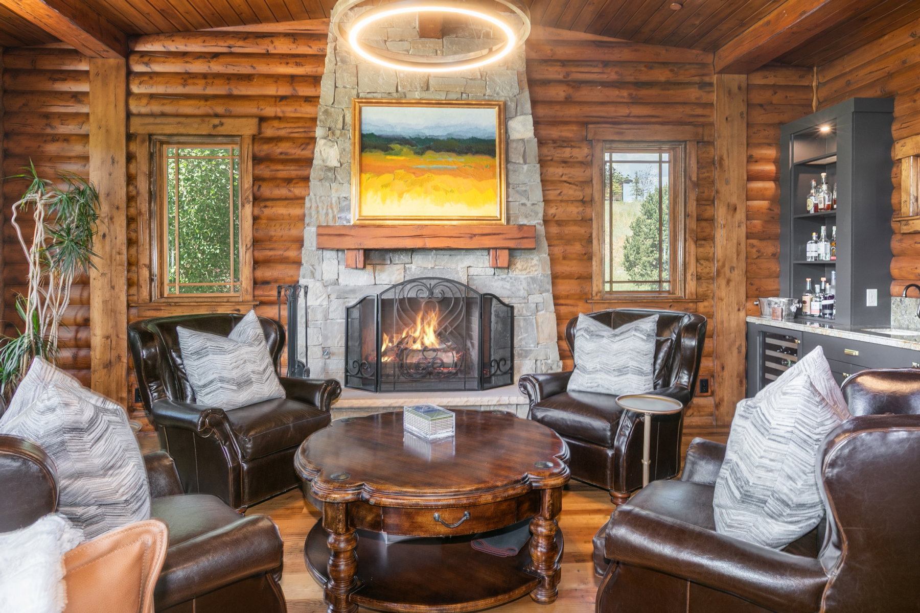 Stone fireplace featuring a wood mantel