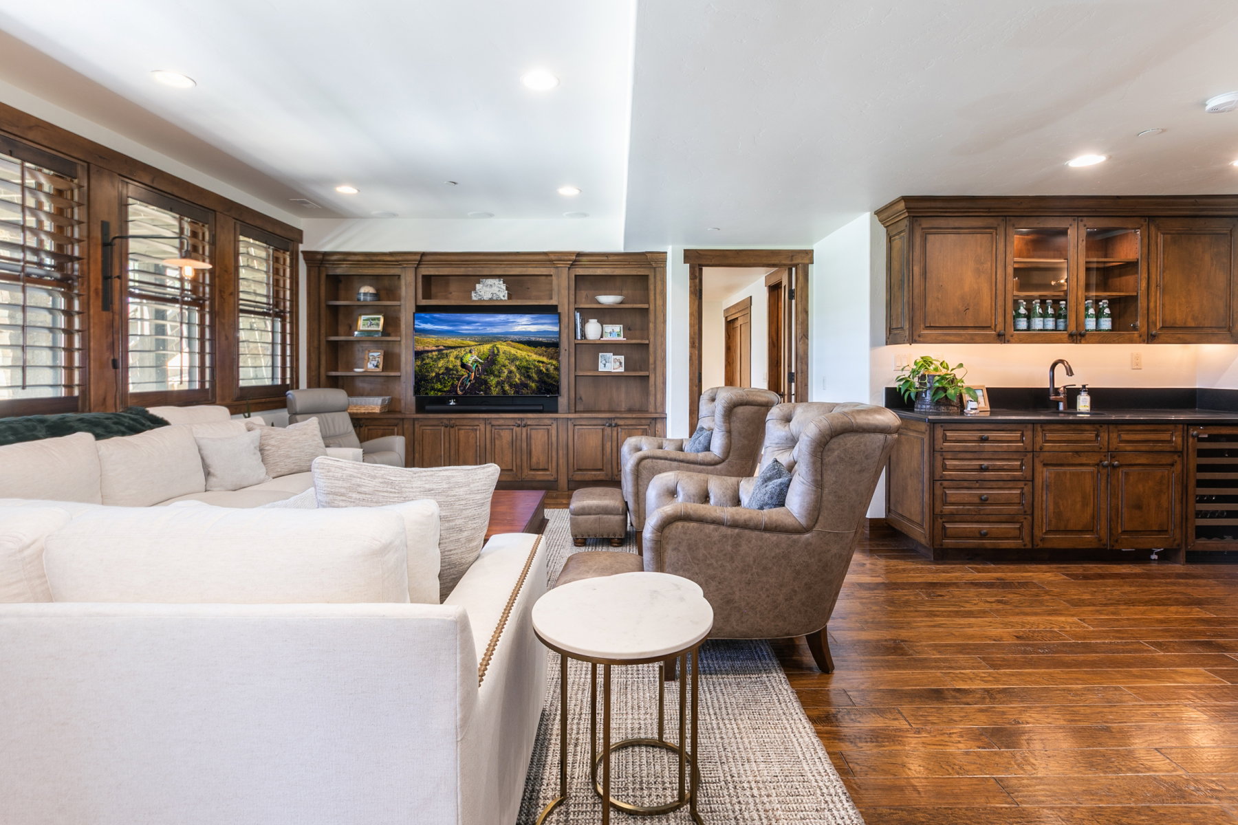 Living area featuring wood-finish flooring and extensive wood built-in cabinetry