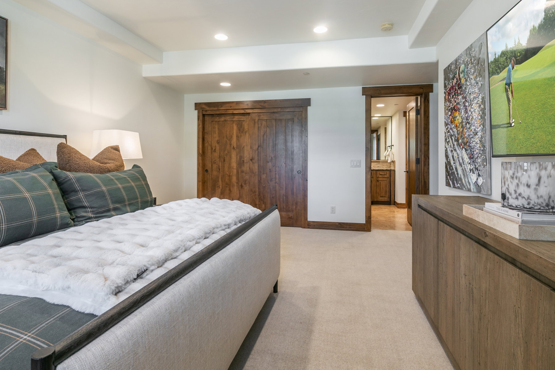 Bedroom featuring light beige carpeting and recessed lighting