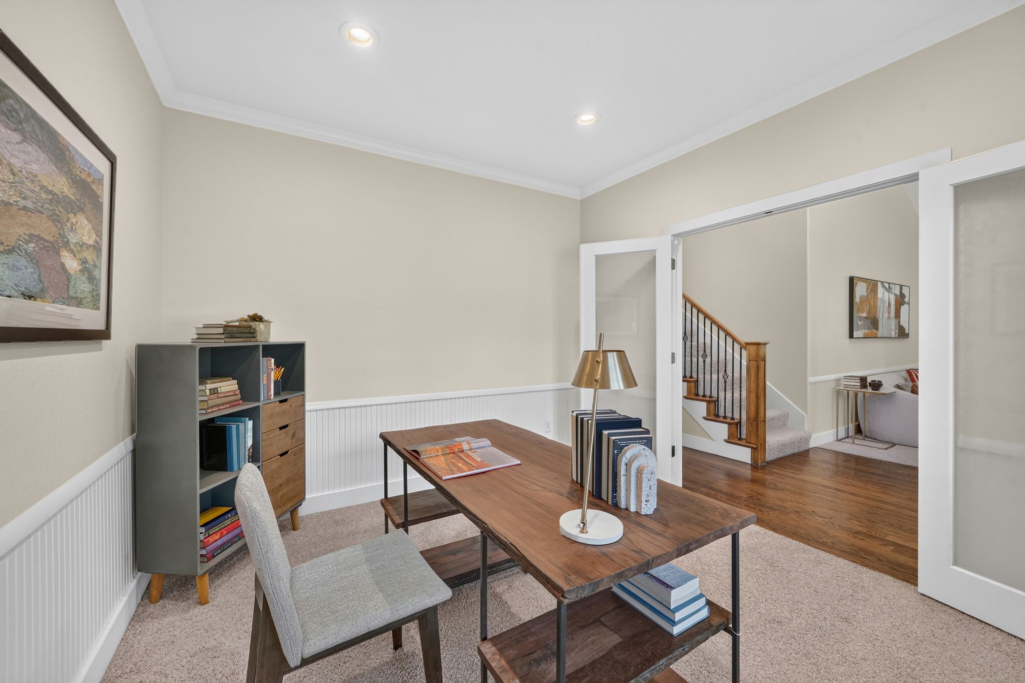 Versatile room featuring crown molding, recessed lighting, beadboard wainscoting, and carpet flooring