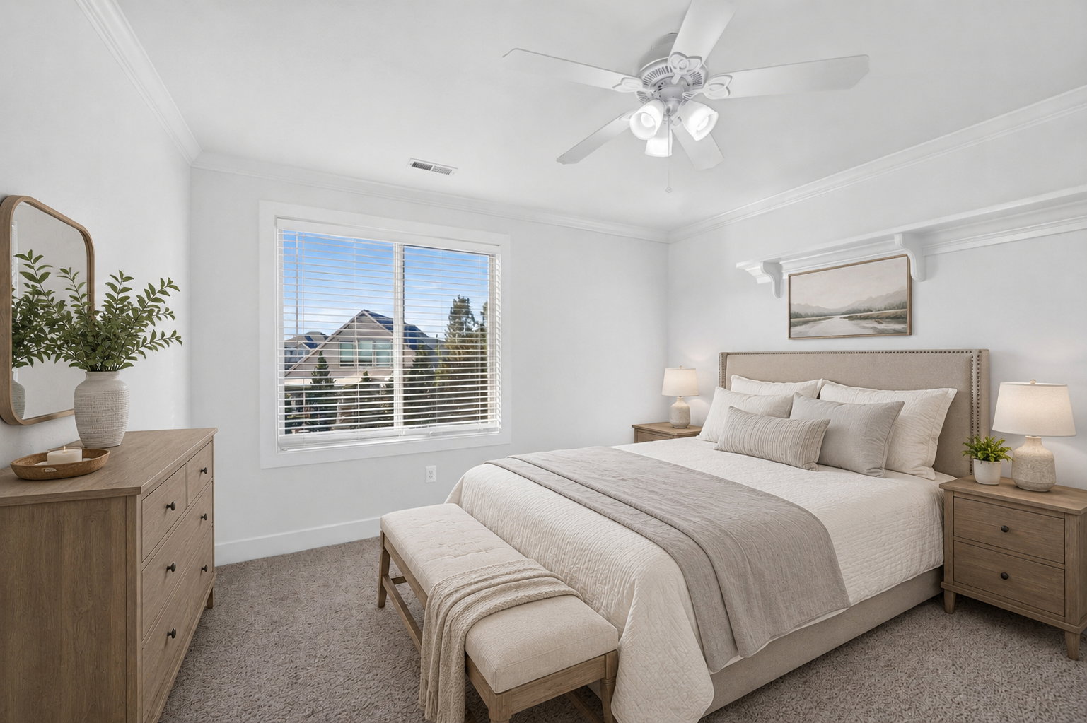 Bedroom featuring a large window, neutral carpeting, crown molding, and a ceiling fan with integrated lighting