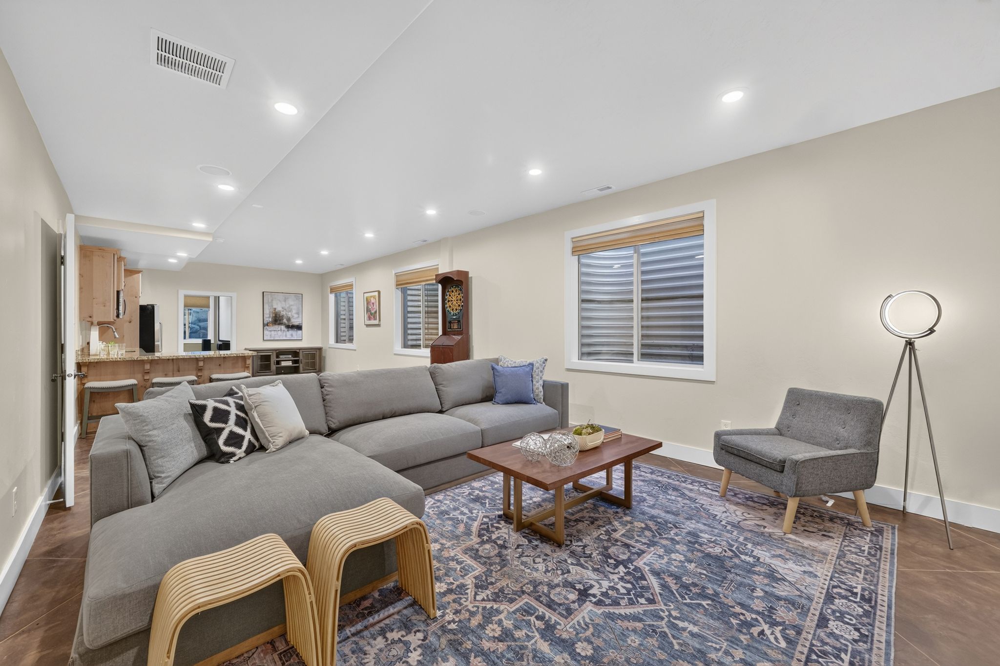 Spacious recreation area featuring recessed lighting and wood-finish flooring