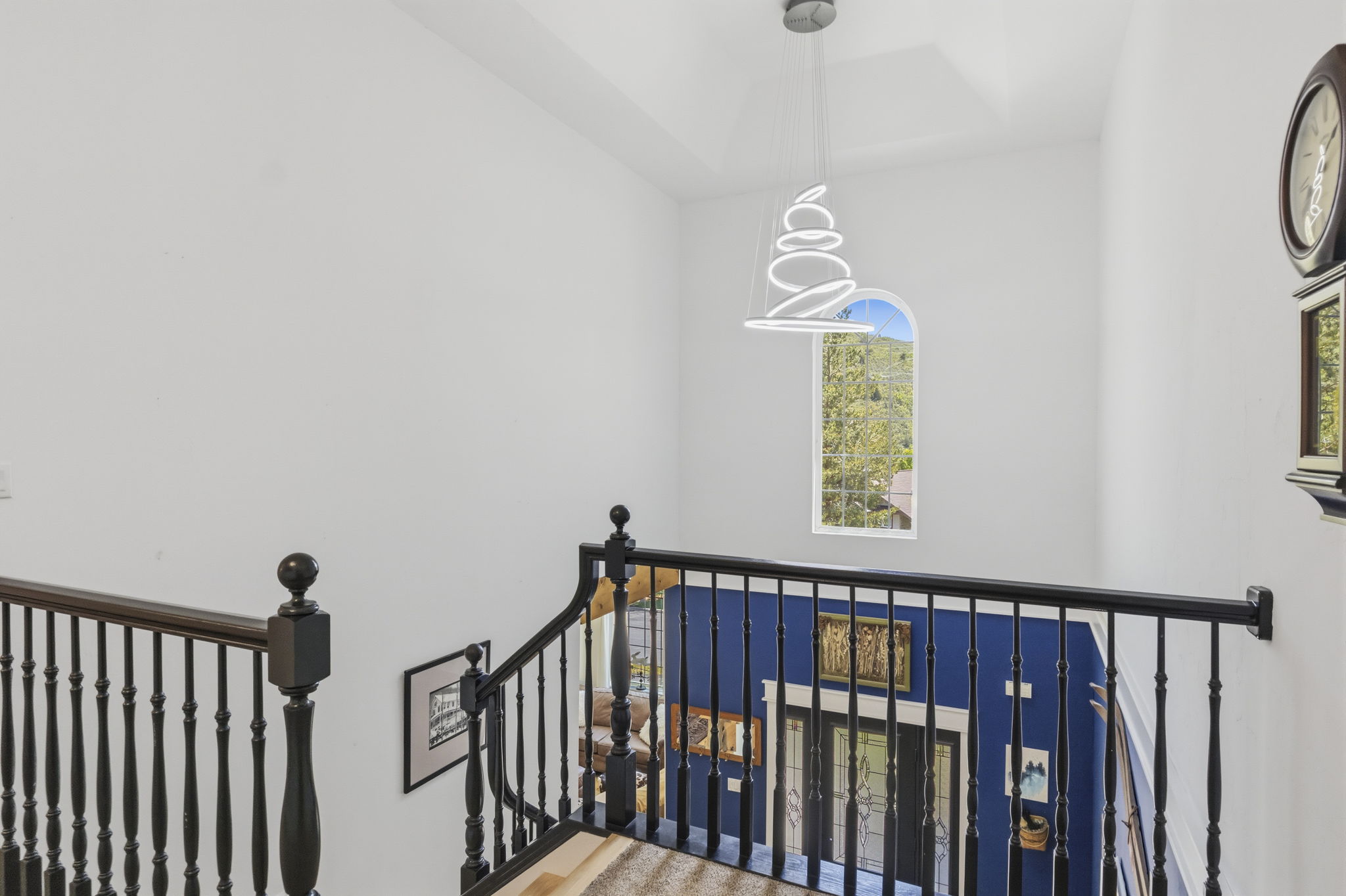 Staircase with black wood balusters and handrails
