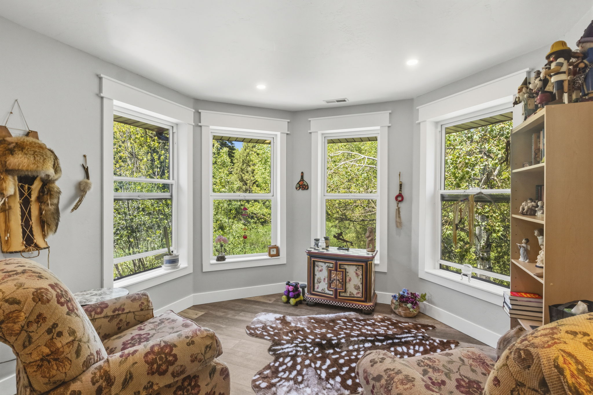 Bay window with multiple double-hung windows and white trim