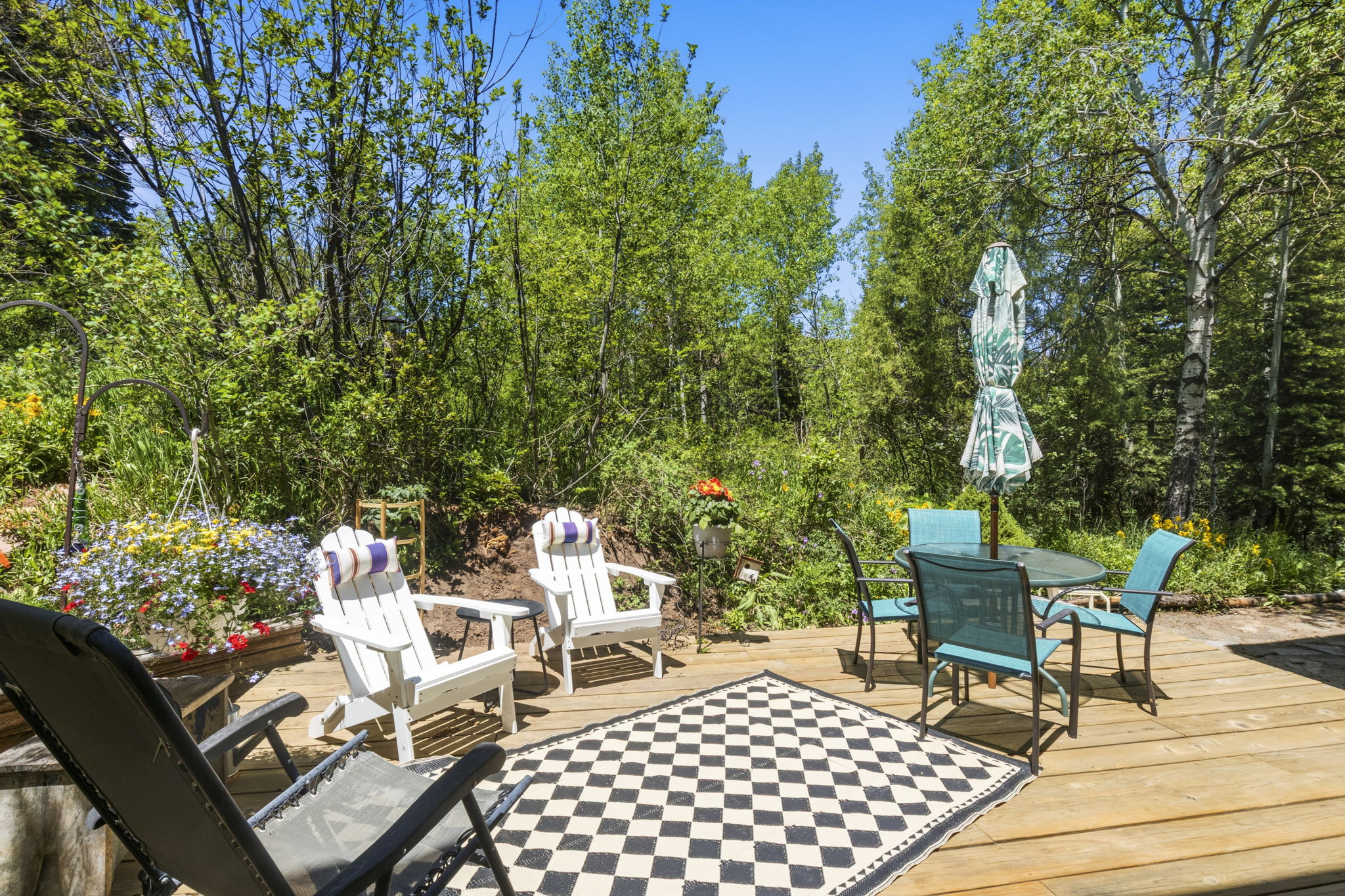 Expansive outdoor deck featuring natural wood planks