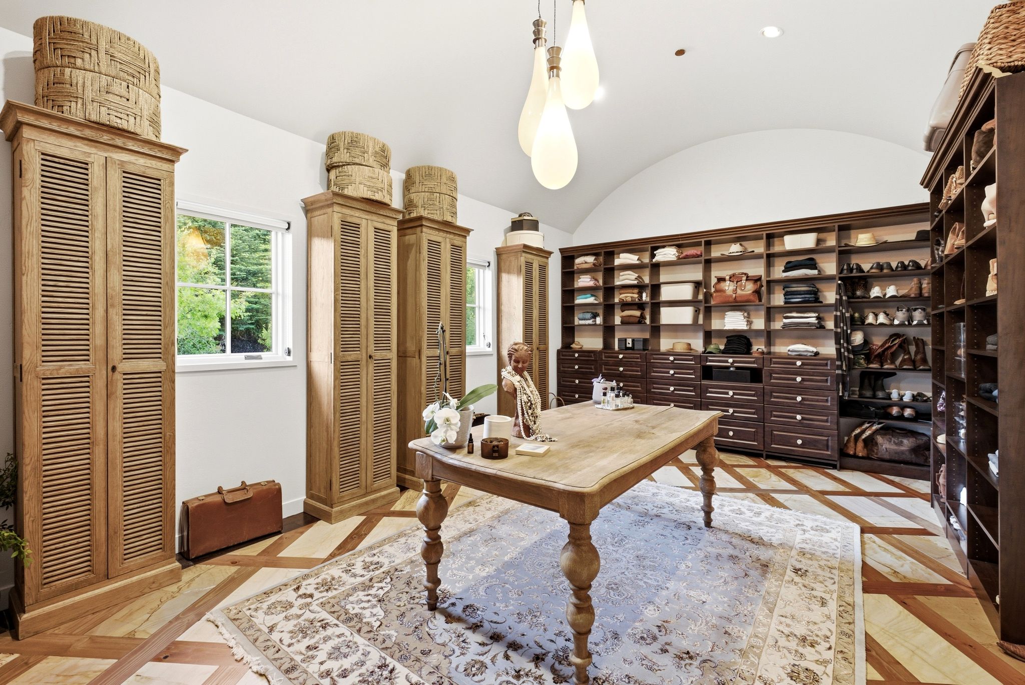 Custom closet room featuring extensive built-in shelving and drawer storage