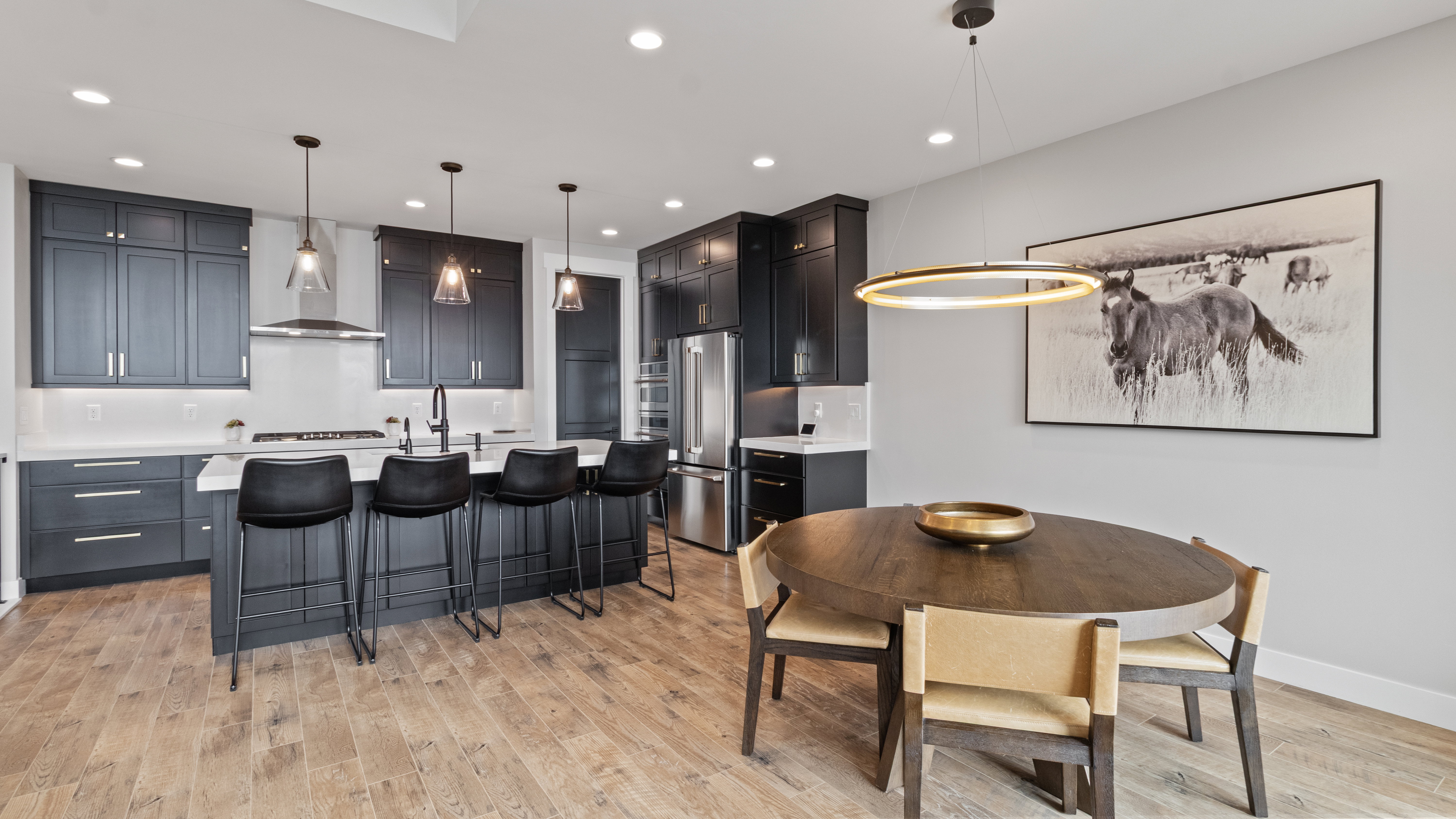 Open-concept living space with wood-finish flooring
