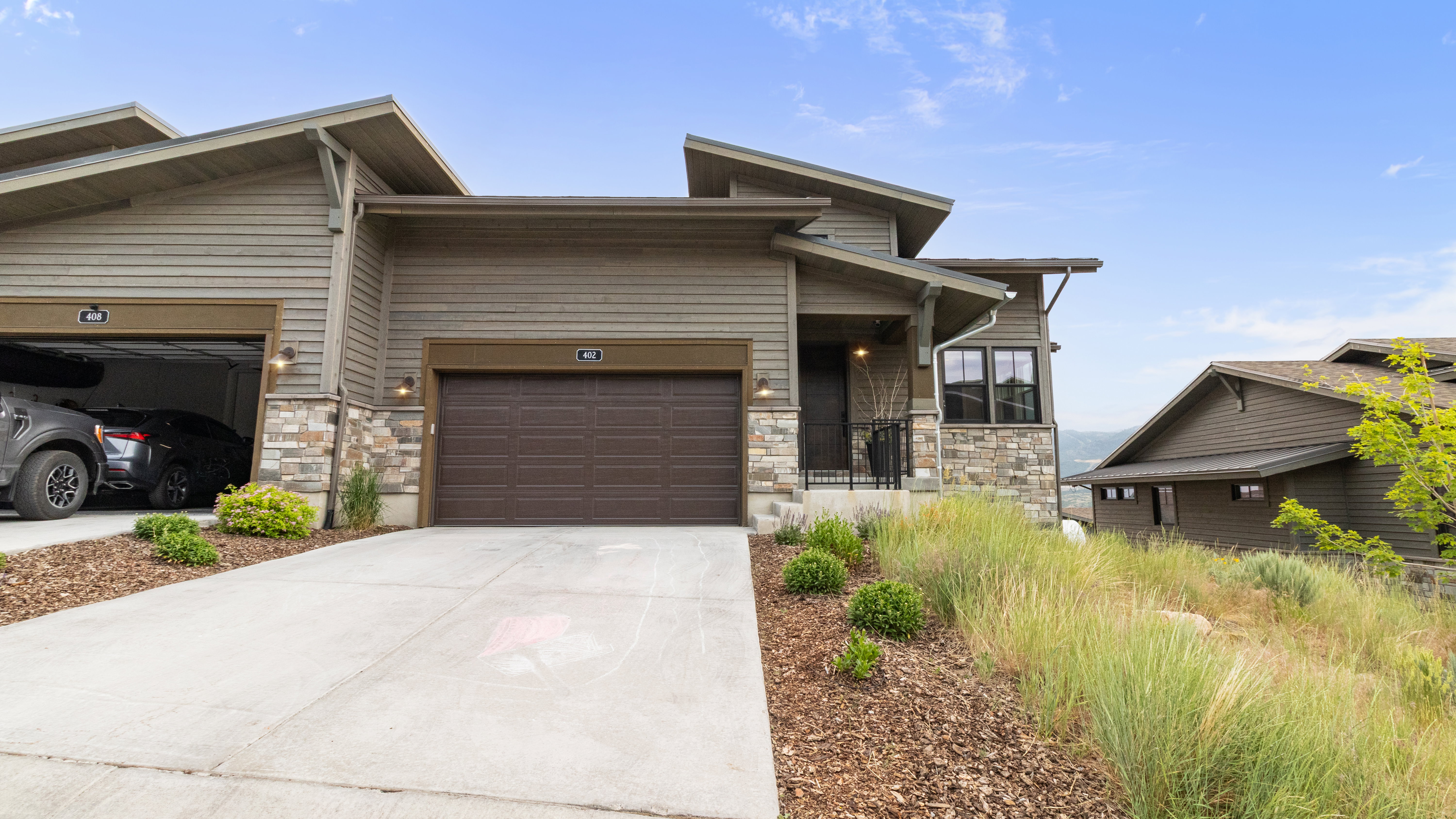 Contemporary exterior featuring horizontal siding and stone accents