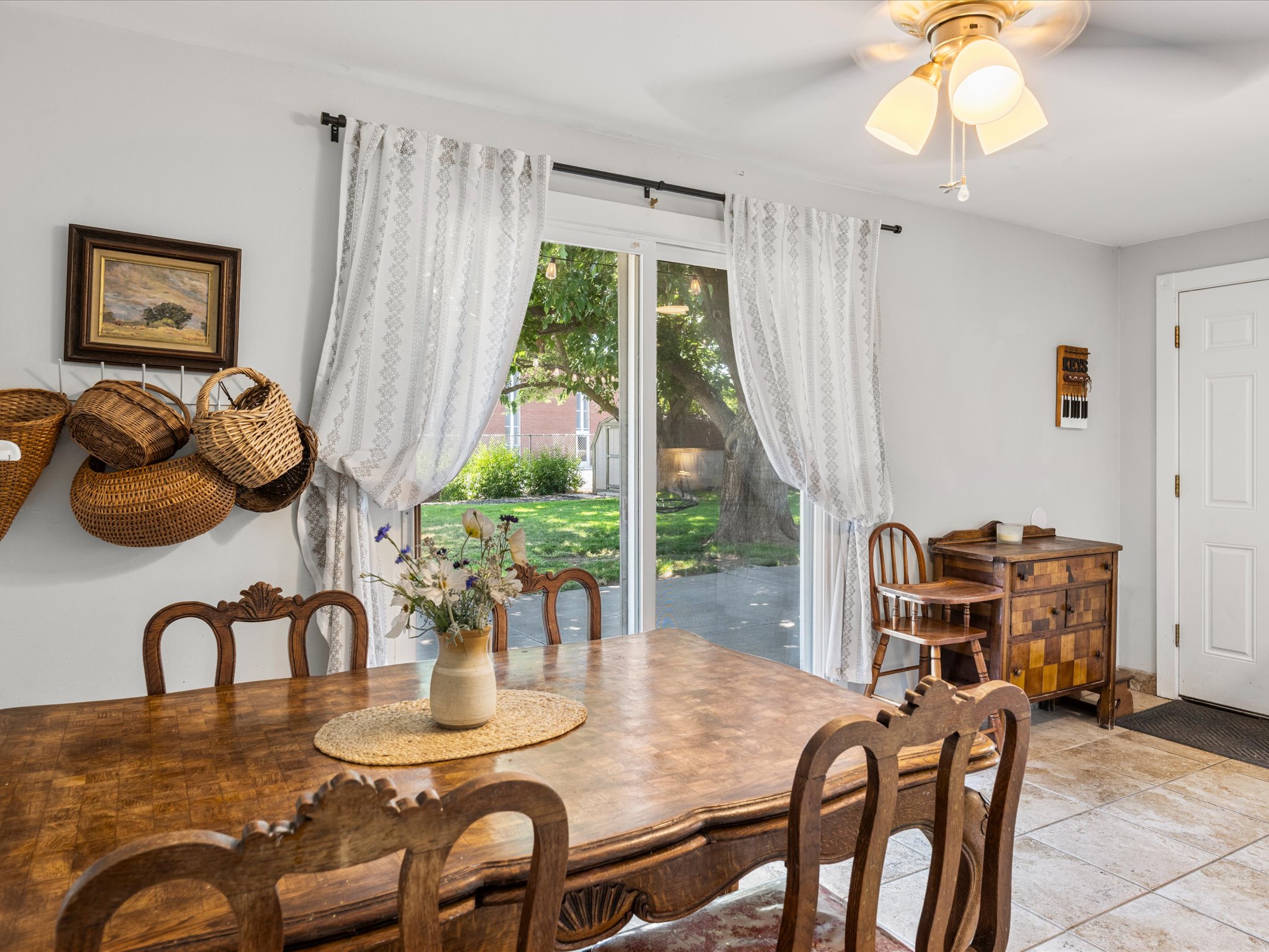 Dining area featuring light walls and tile flooring