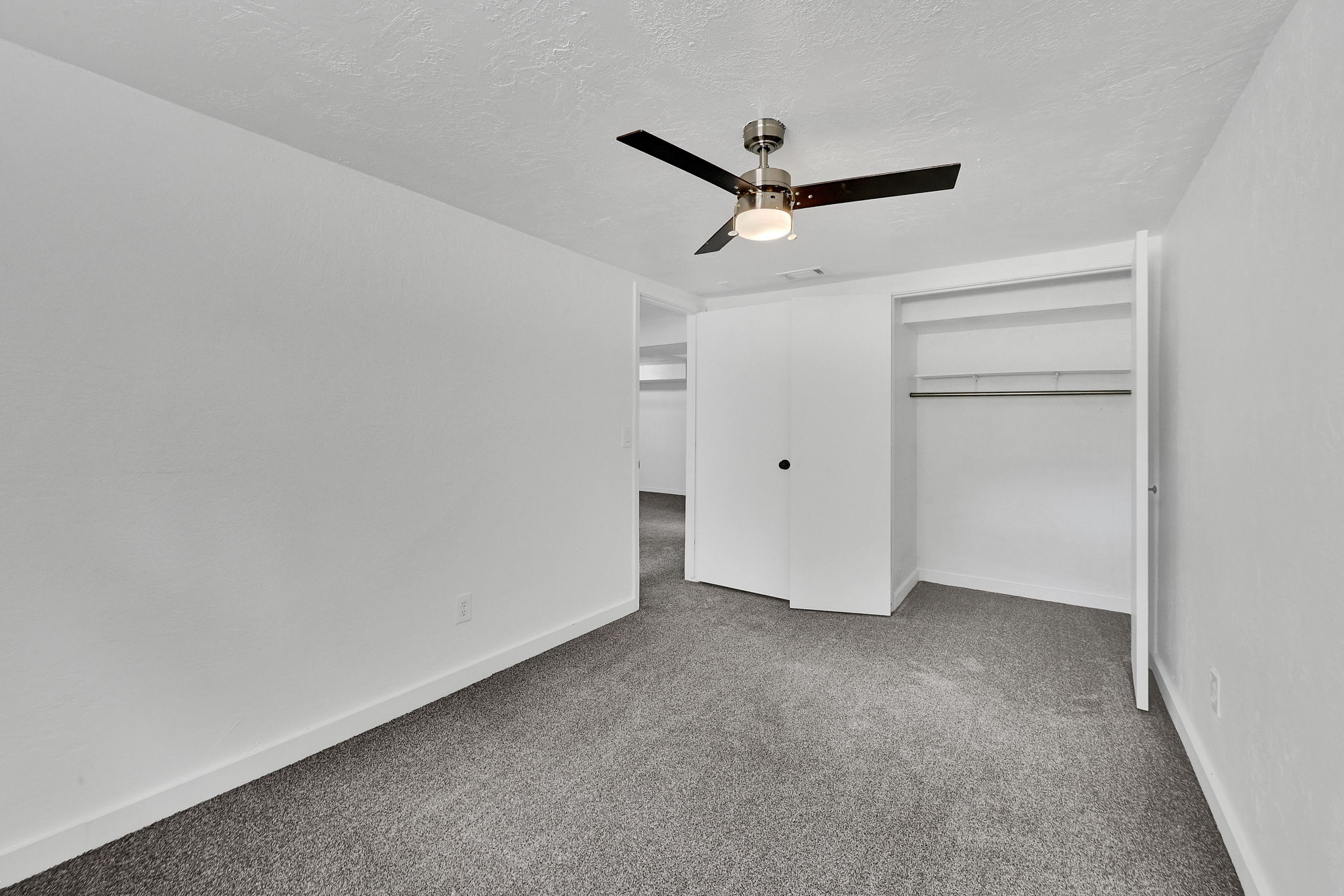 Neutral white walls with gray carpeting
