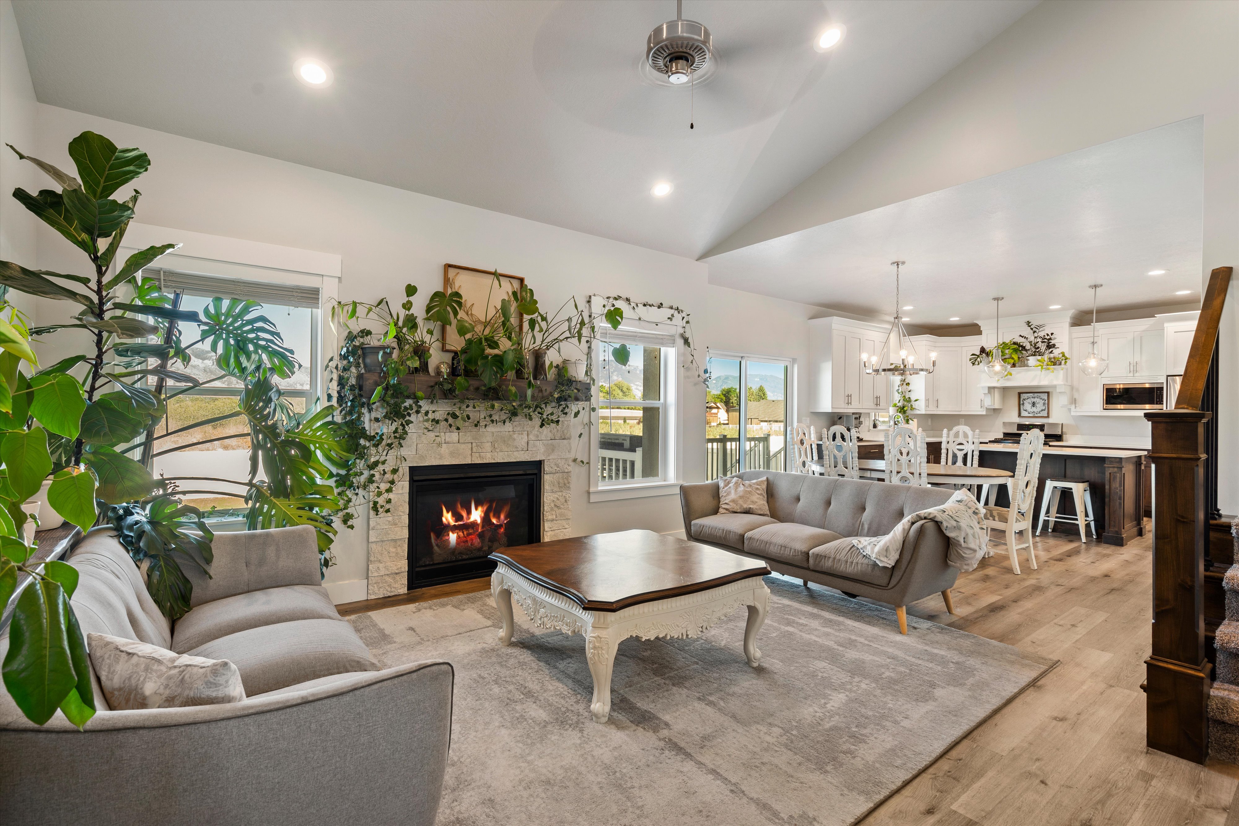 Vaulted ceilings accentuating a stone-front fireplace