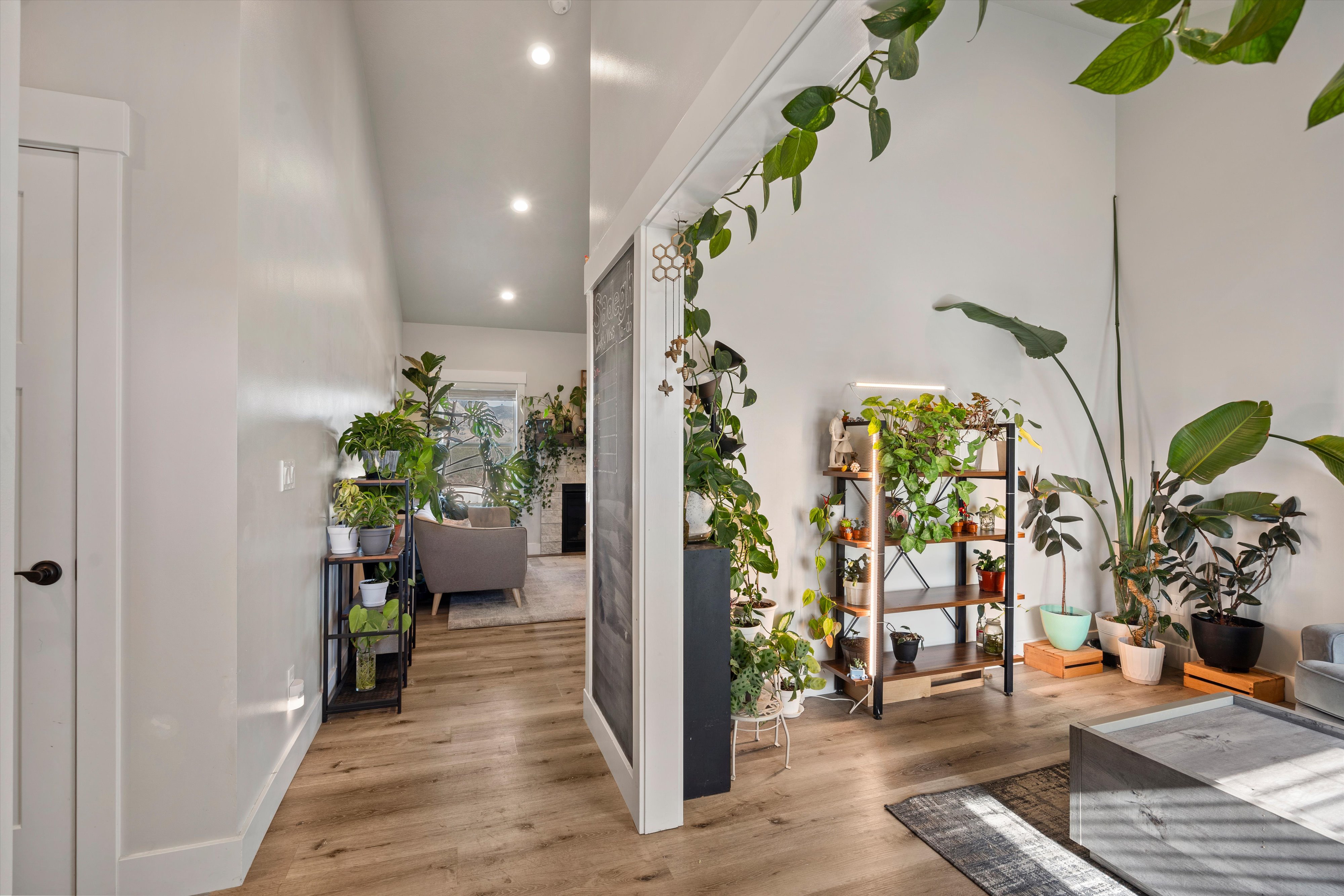 Bright interior featuring light wood-finish flooring, recessed lighting, and white walls