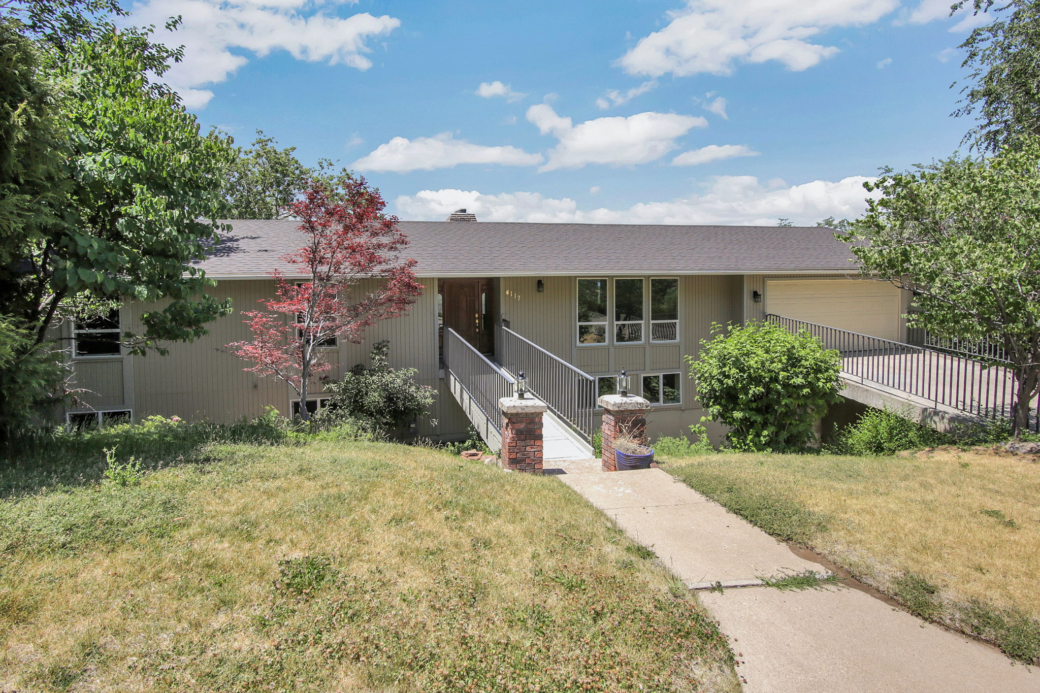 Beautiful rambler in highly desirable area above Weber State
