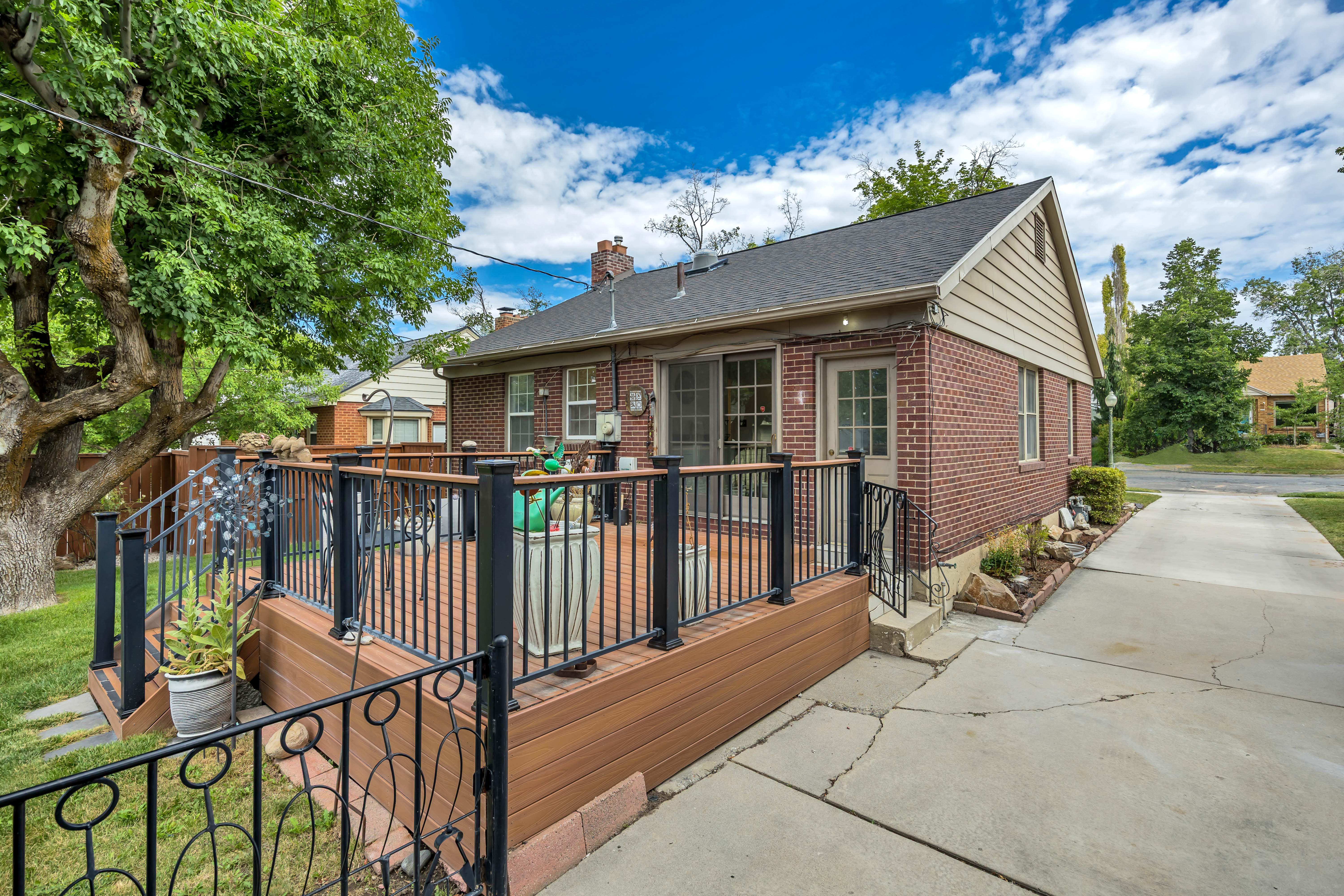 Spacious composite deck with black metal railings