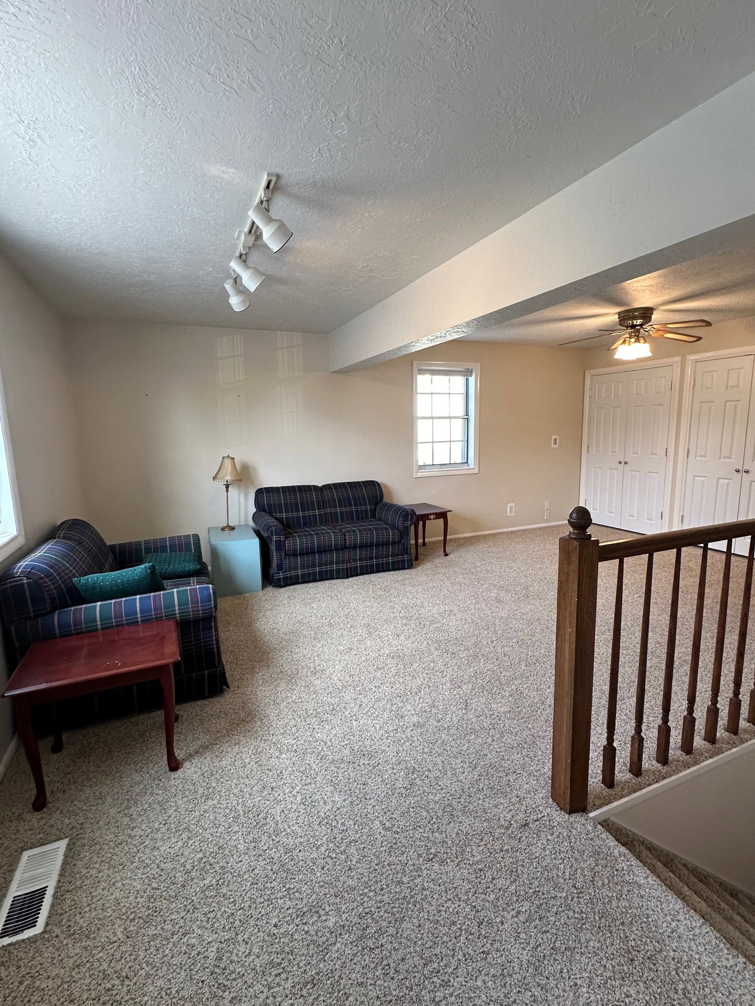 Spacious second family room featuring neutral carpeting and light-toned walls