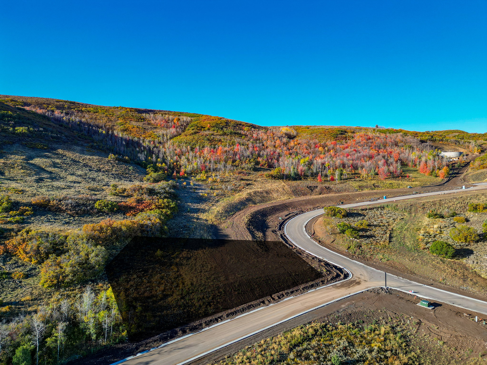Expansive land parcel with surrounding natural terrain