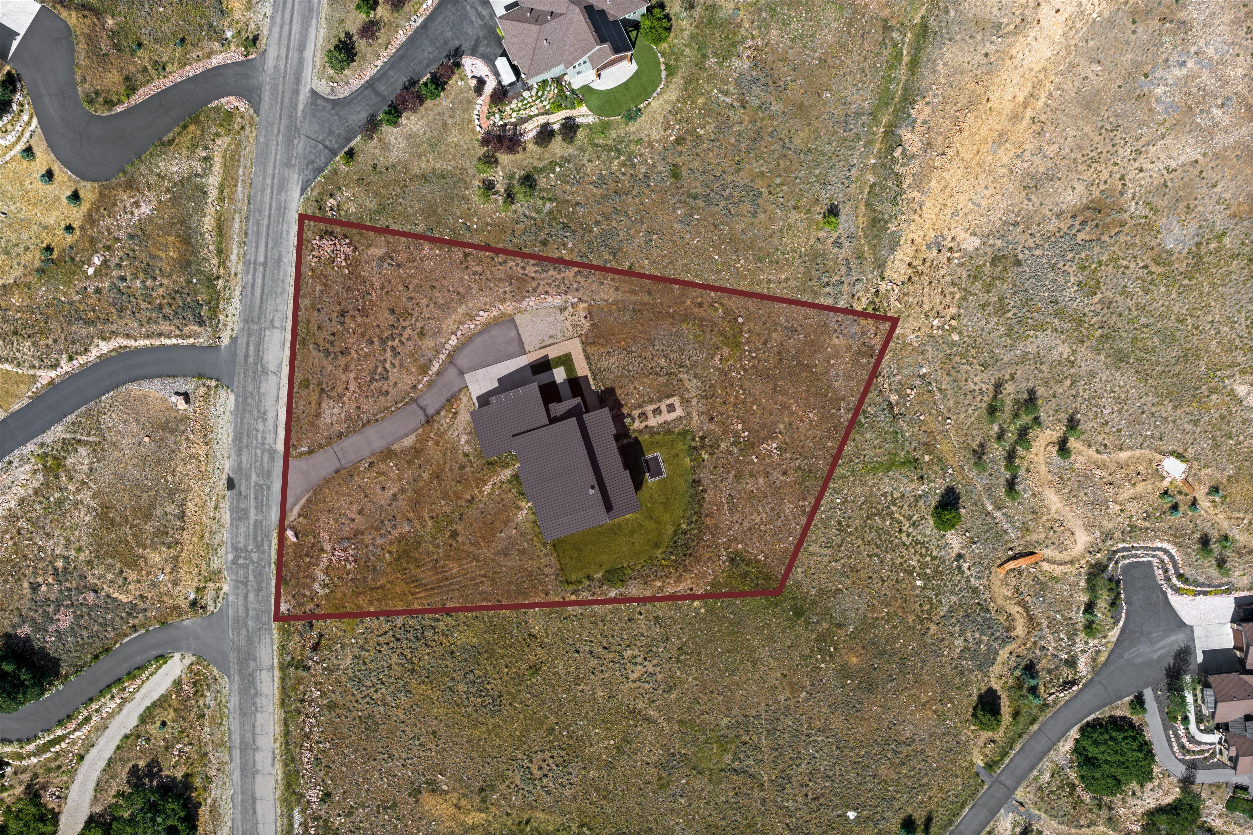 Aerial view showcasing a property with a distinct perimeter