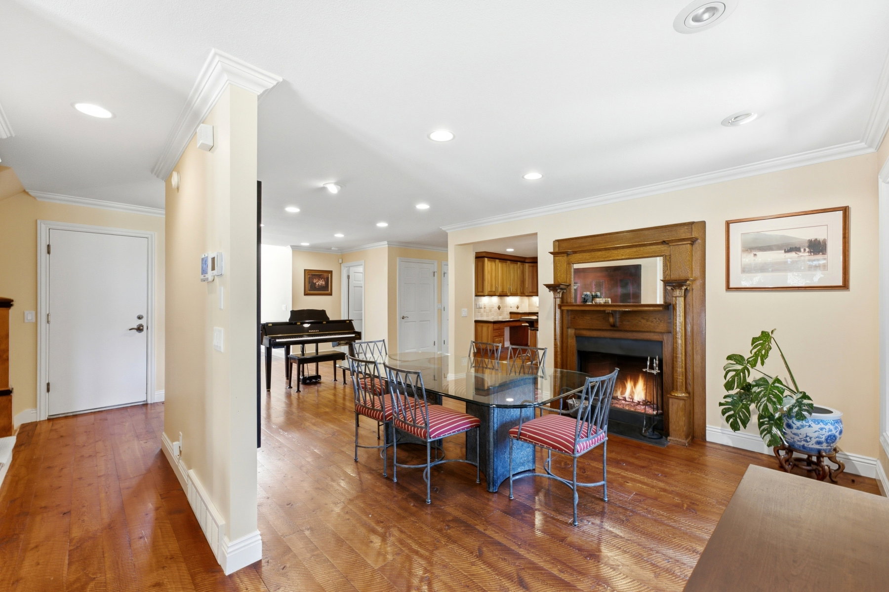 Spacious interior featuring wood-finish flooring, recessed lighting, and crown molding