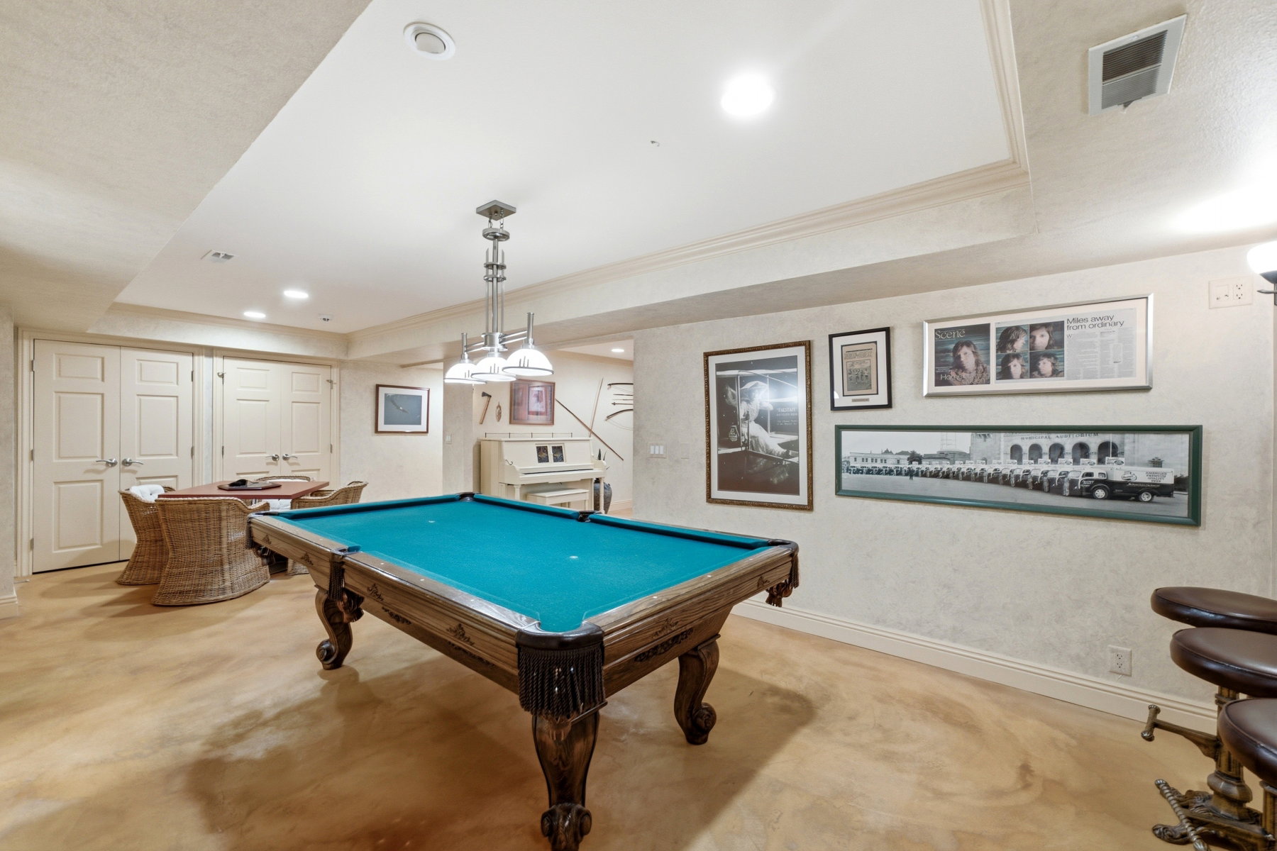 Recreation room featuring a pool table with ornate wood base, recessed lighting, crown molding, and double-door storage