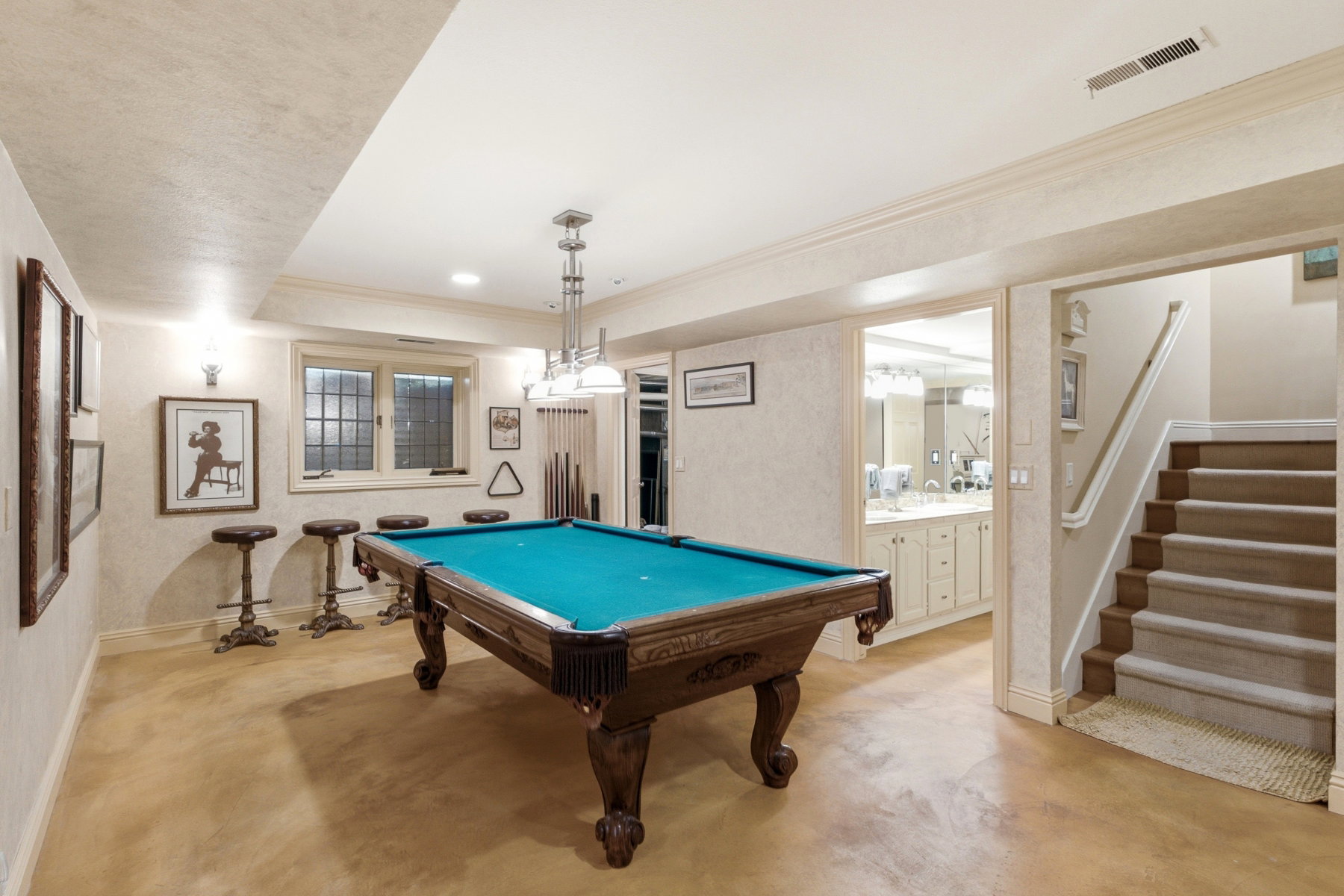 Recreational space featuring hard-surface flooring, recessed lighting, and a multi-light pendant fixture