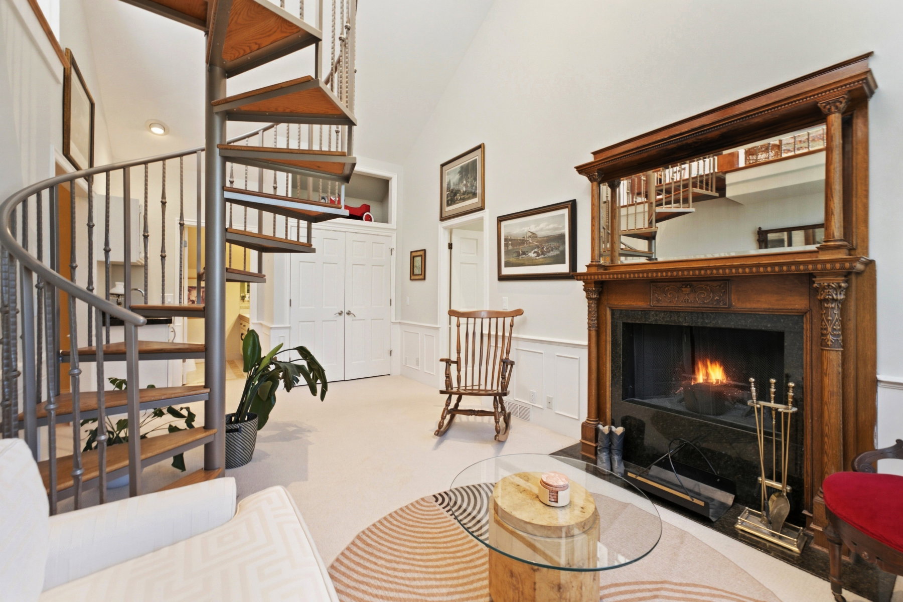 Spiral staircase with wood-finish treads and metal balusters