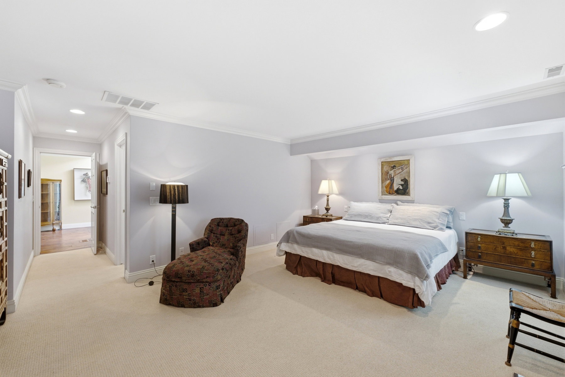 Carpeted bedroom featuring crown molding, recessed lighting, and a neutral wall palette