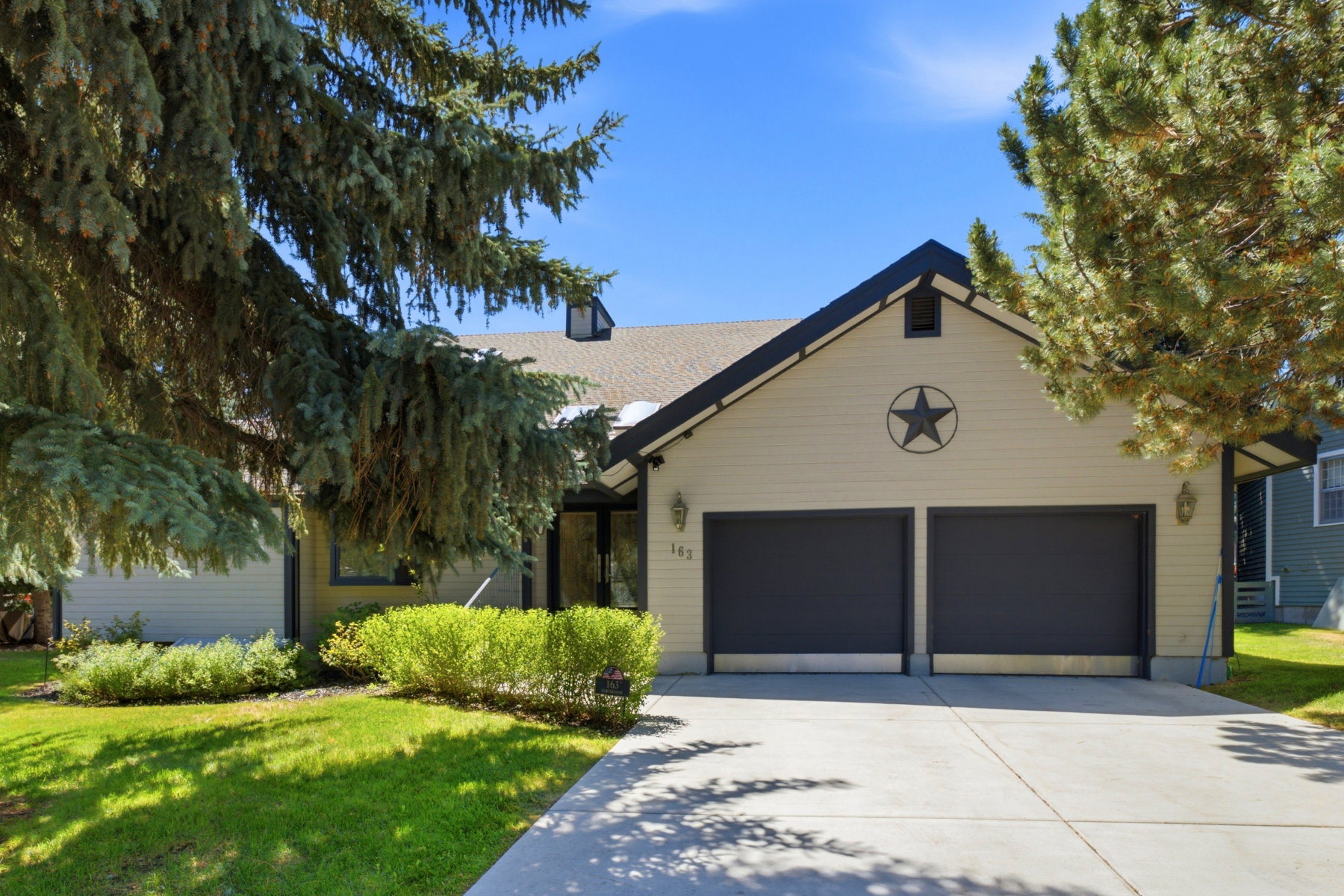 Single-story residence featuring a dual garage and a neutral-toned exterior