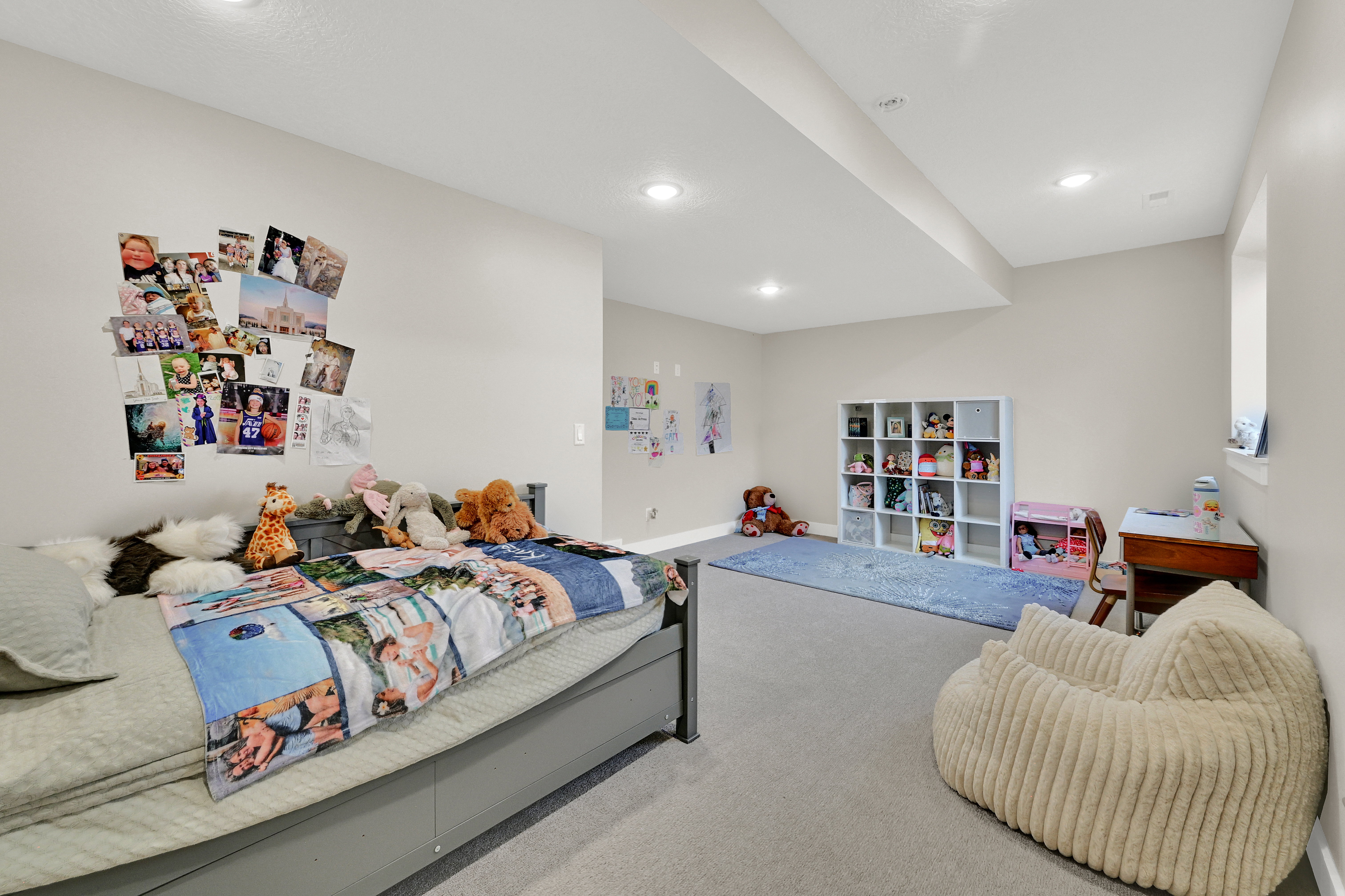 Carpeted room featuring a window, recessed lighting, and neutral wall paint