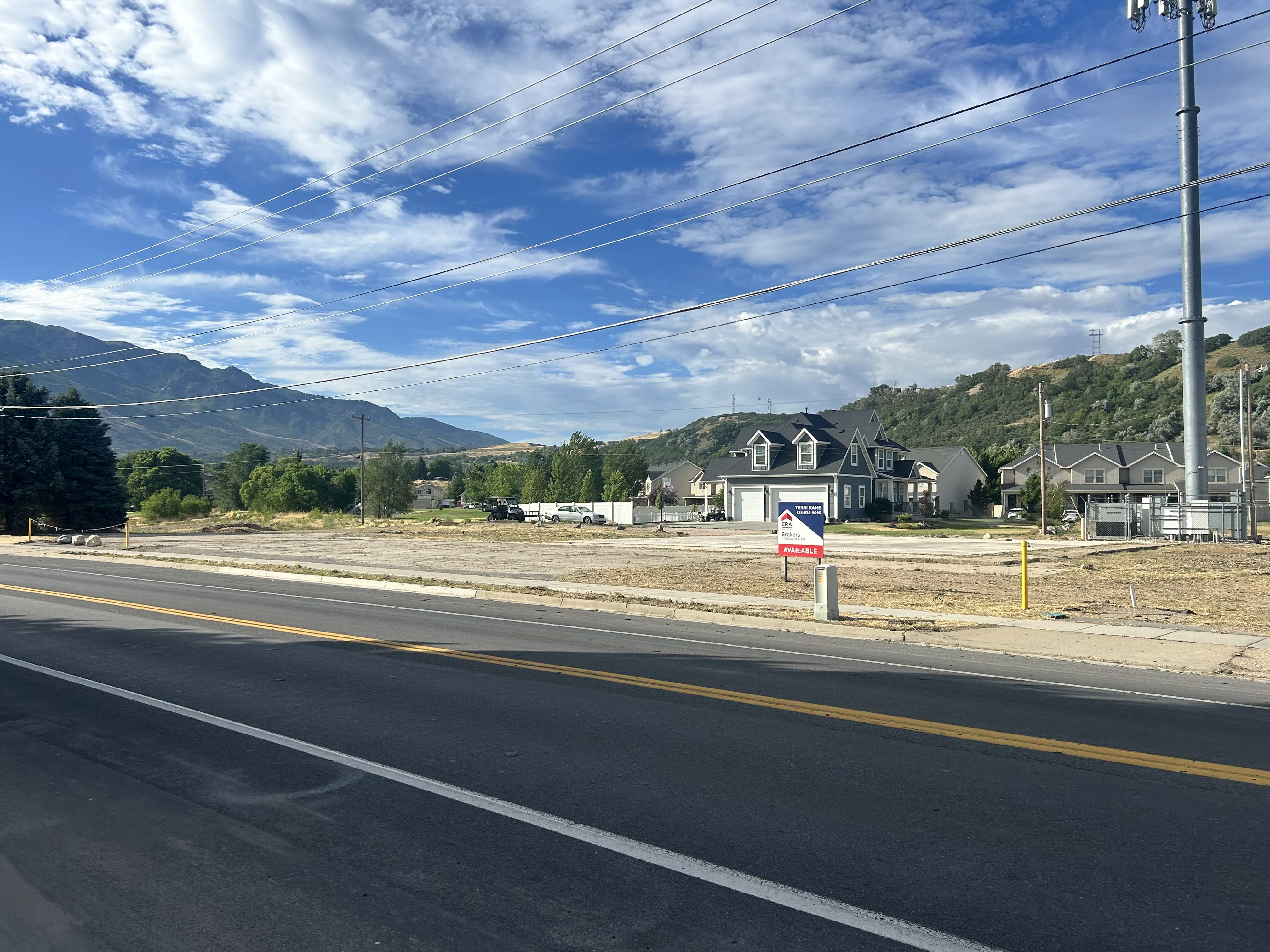 Expansive cleared lot with visible road frontage