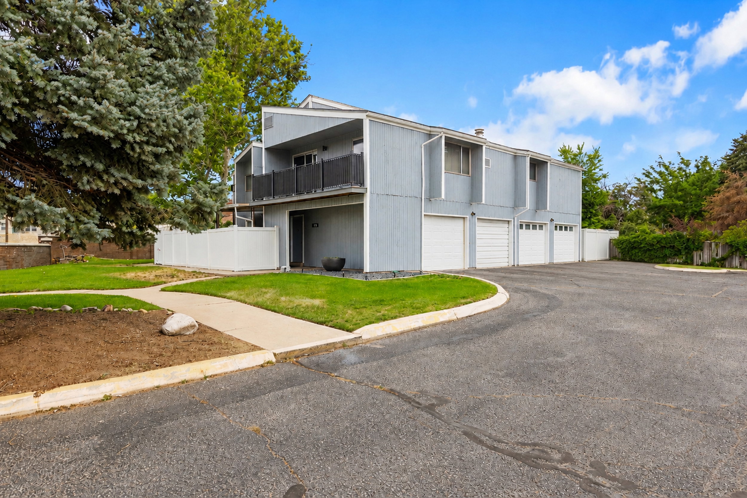 Multi-level facade with light gray siding