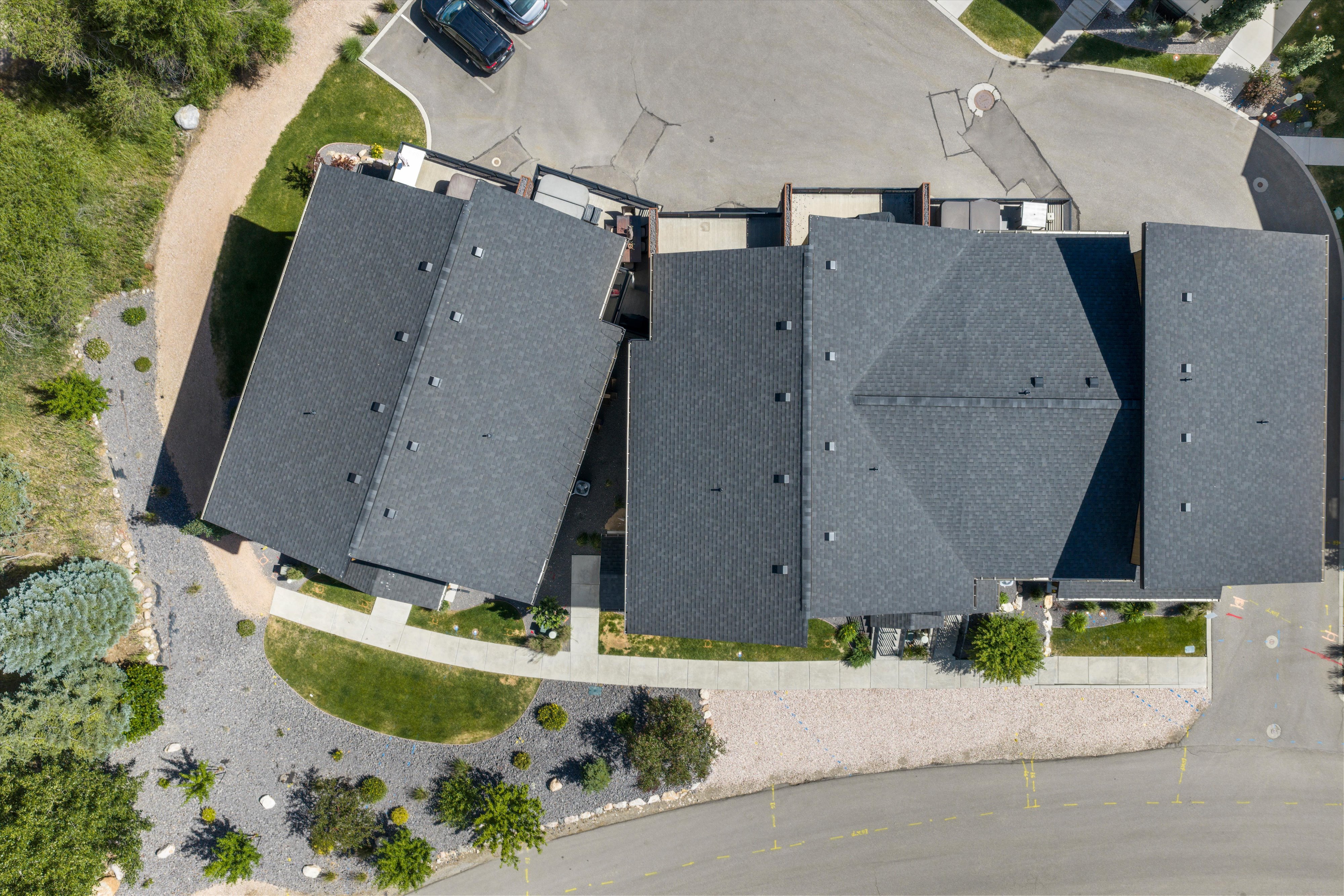 Overhead perspective showcasing a residential structure with an asphalt shingle roof