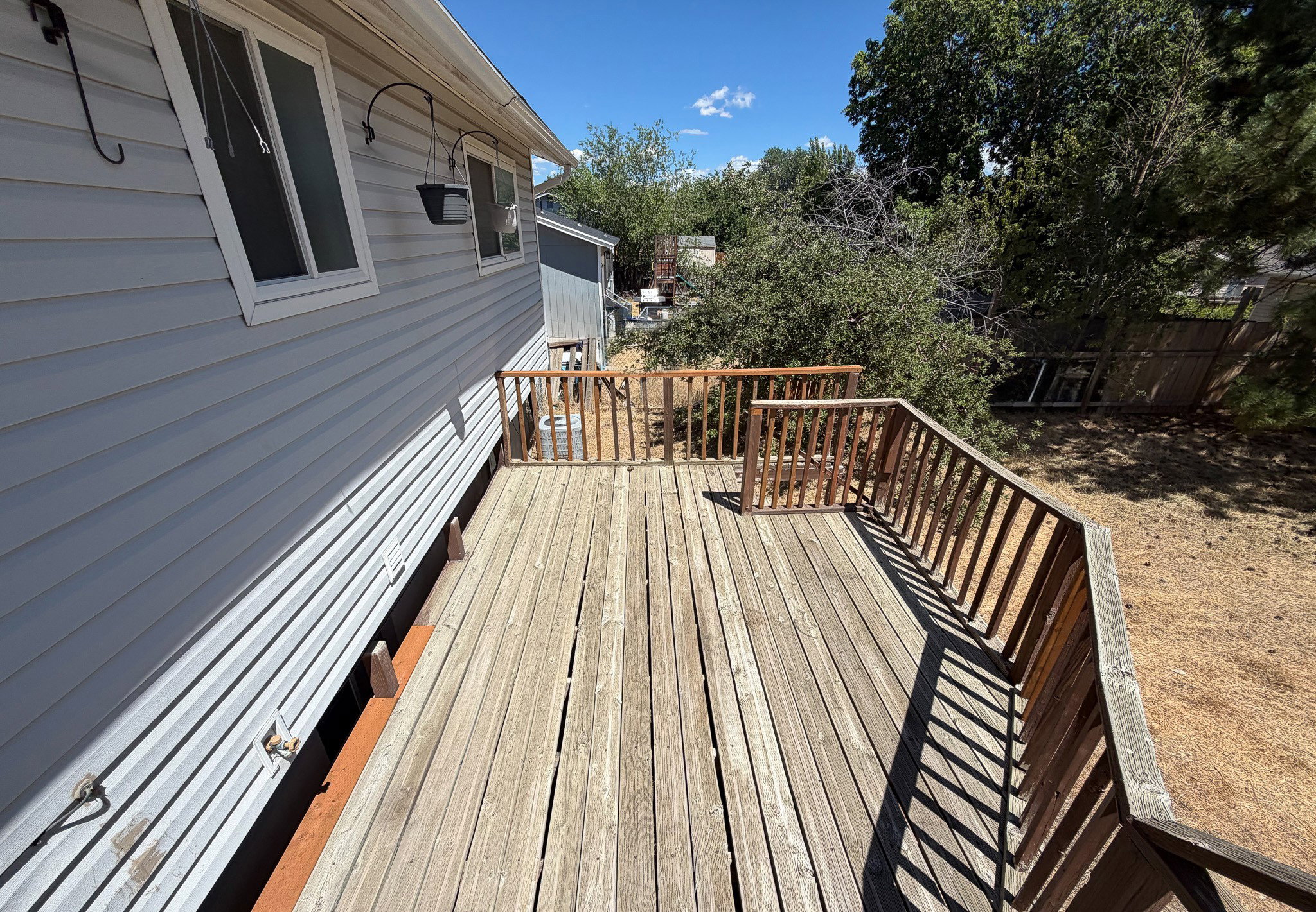 Expansive wooden deck with coordinating wood railings