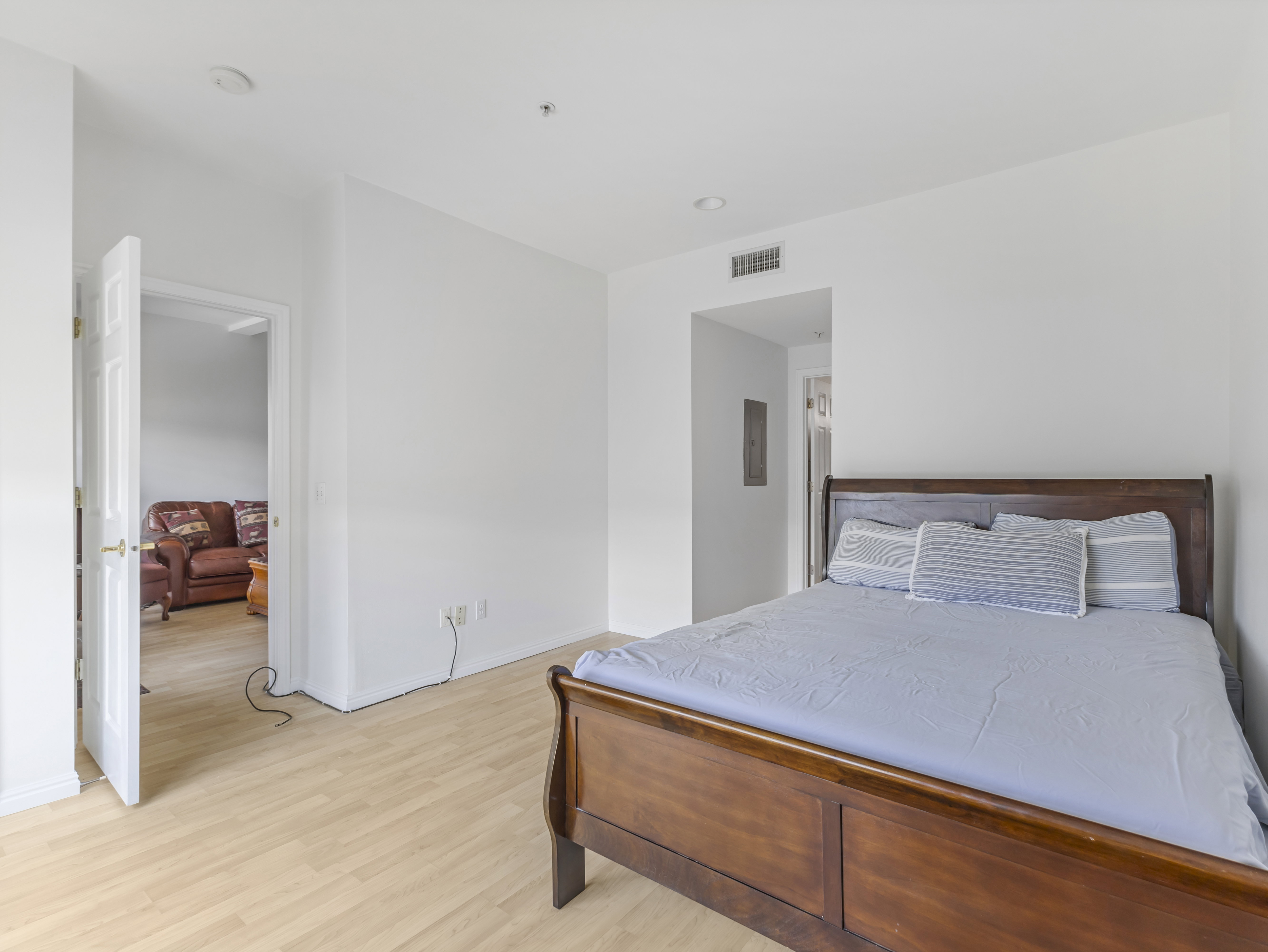 Bright interior space featuring light wood-finish flooring and white walls
